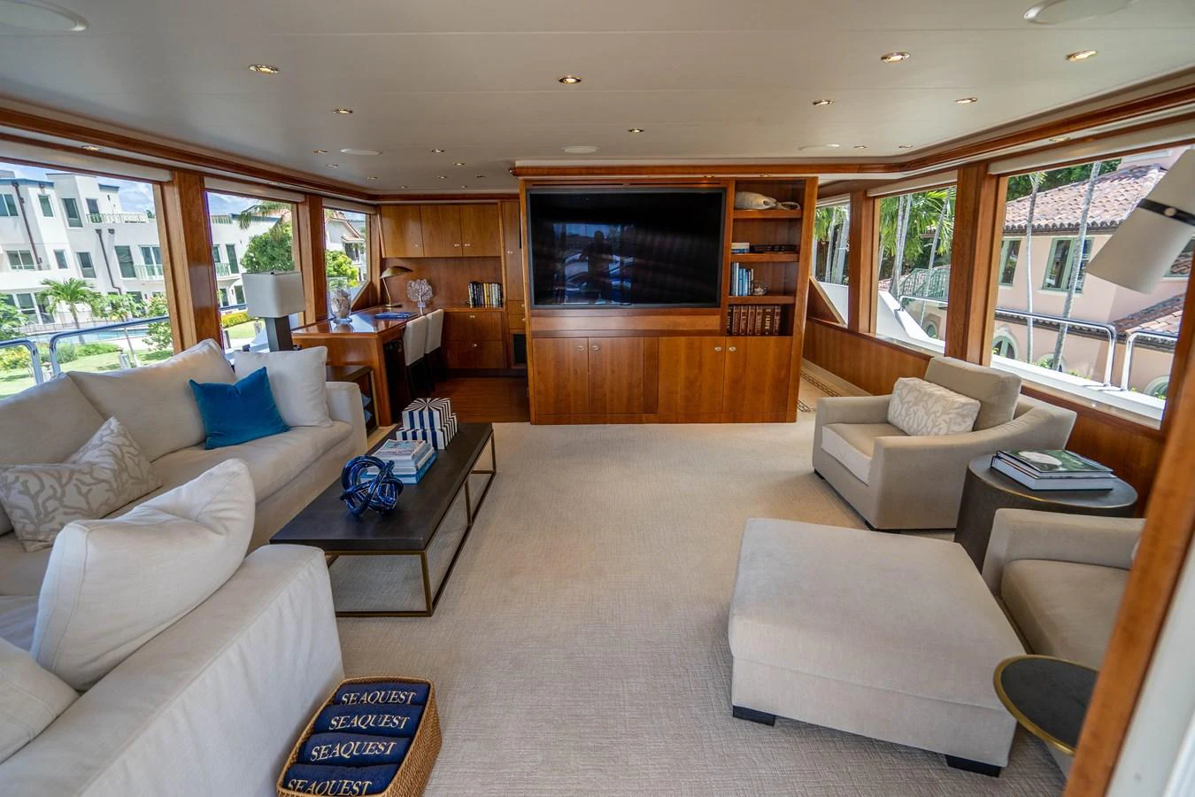 a living room with a fireplace aboard SEAQUEST Yacht for Sale