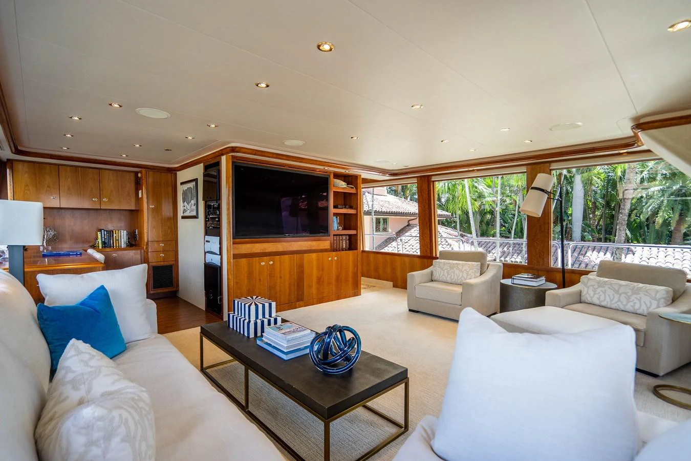 a living room with a large tv aboard SEAQUEST Yacht for Sale