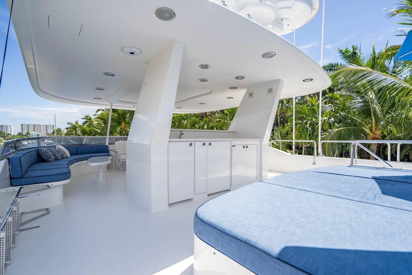 a room with a pool and a table and chairs aboard SEAQUEST Yacht for Sale