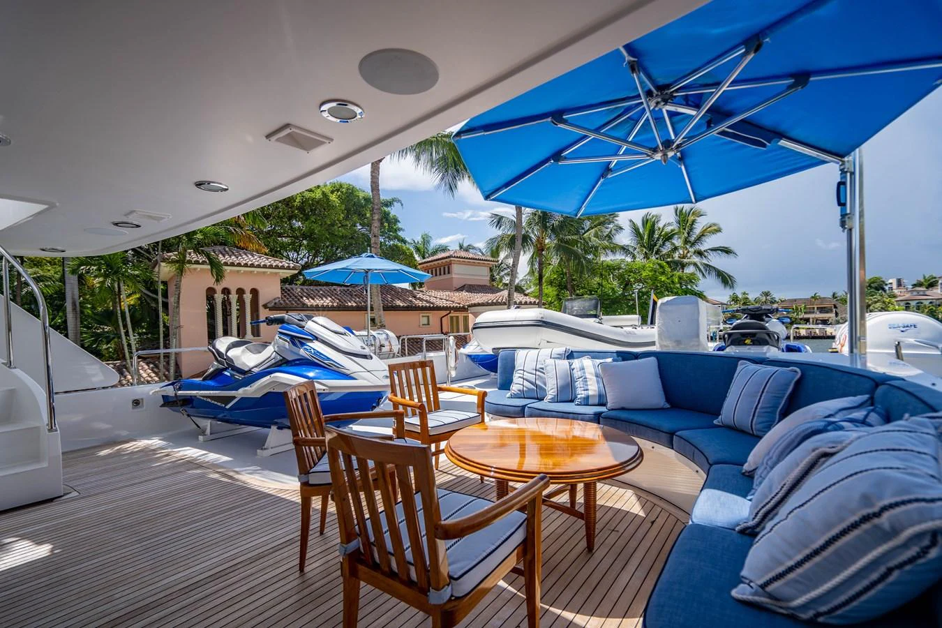 a deck with chairs and tables aboard SEAQUEST Yacht for Sale