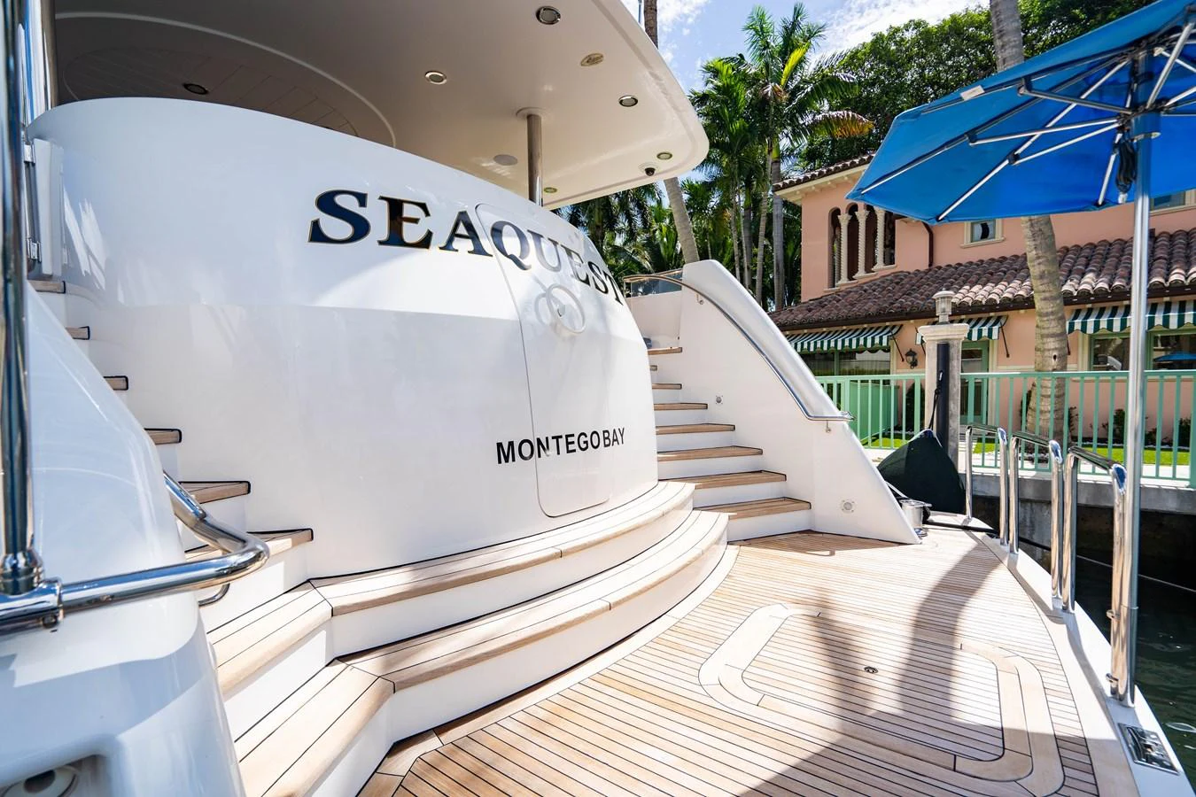 a white boat on a dock aboard SEAQUEST Yacht for Sale