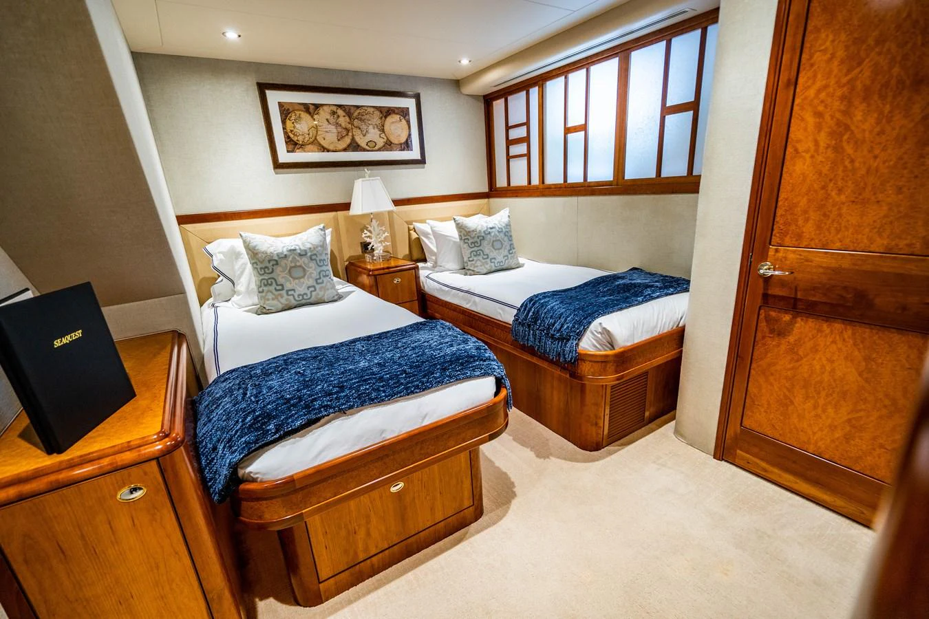 a couple of beds in a hotel room aboard SEAQUEST Yacht for Sale