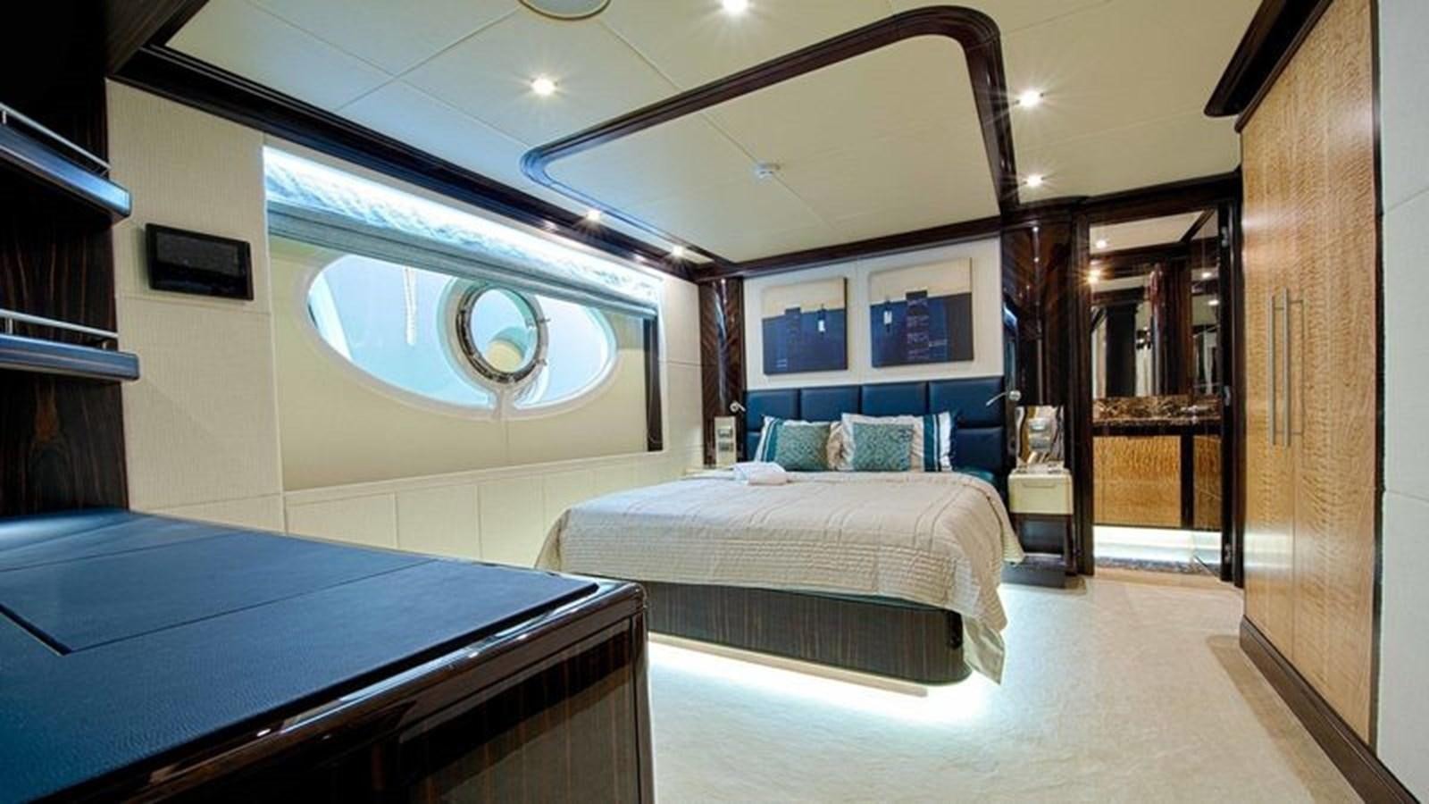 a room with a couple of beds aboard OCTOBER Yacht for Sale