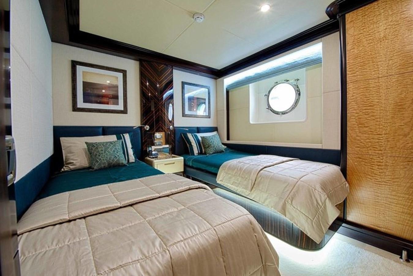 a couple of beds in a room aboard OCTOBER Yacht for Sale