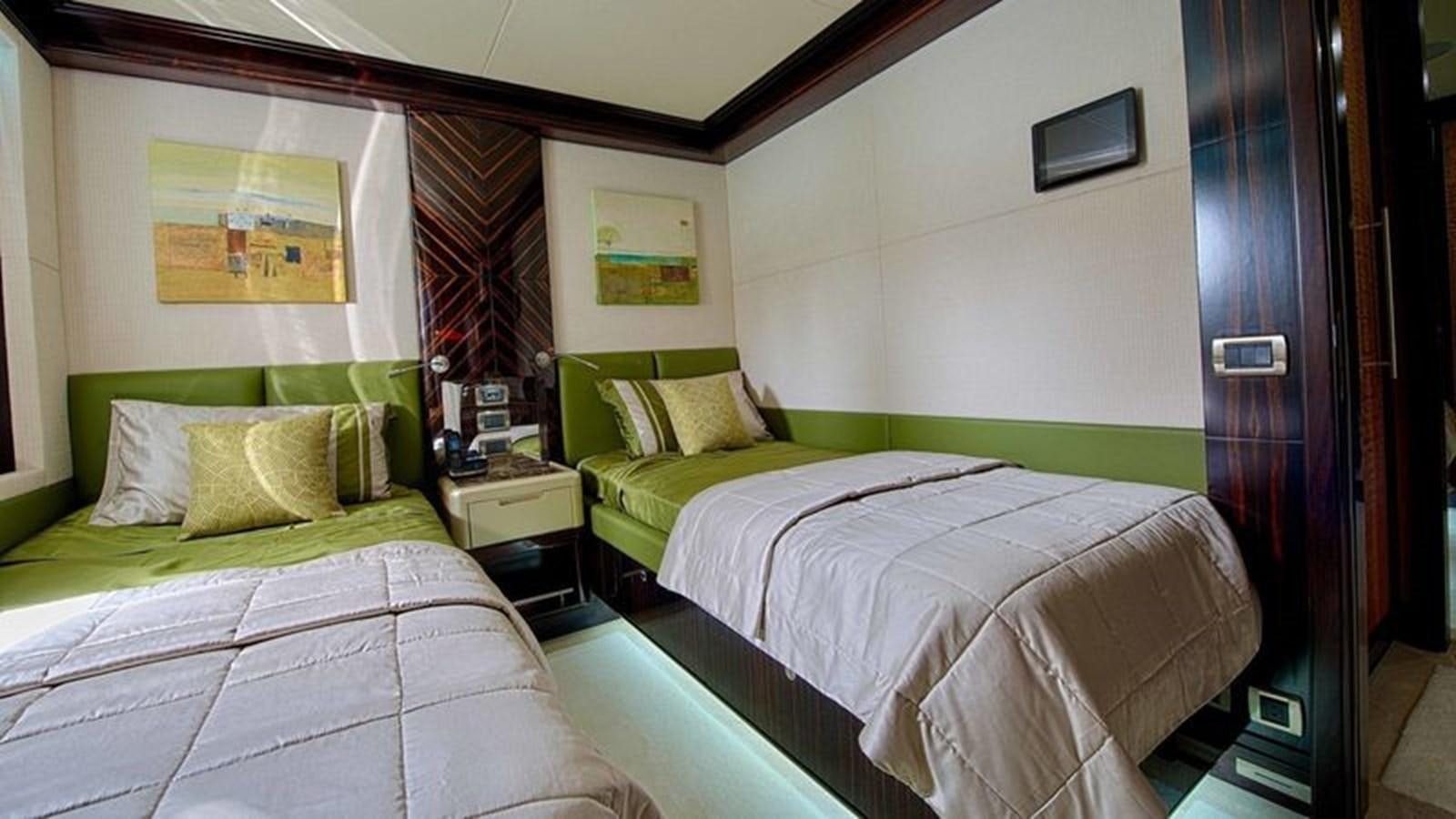 a couple of beds in a room aboard OCTOBER Yacht for Sale