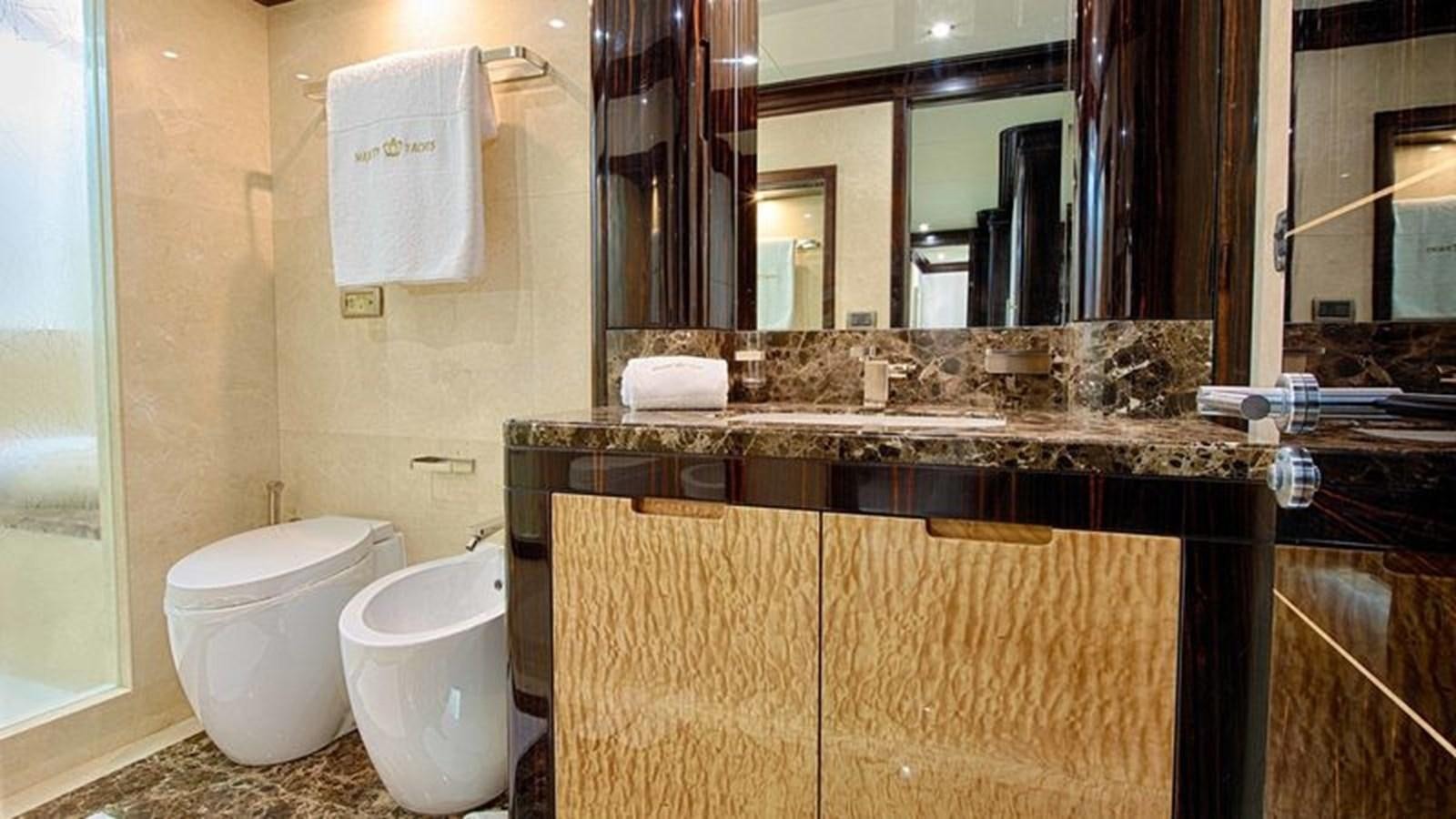 a bathroom with a couple of toilets aboard OCTOBER Yacht for Sale