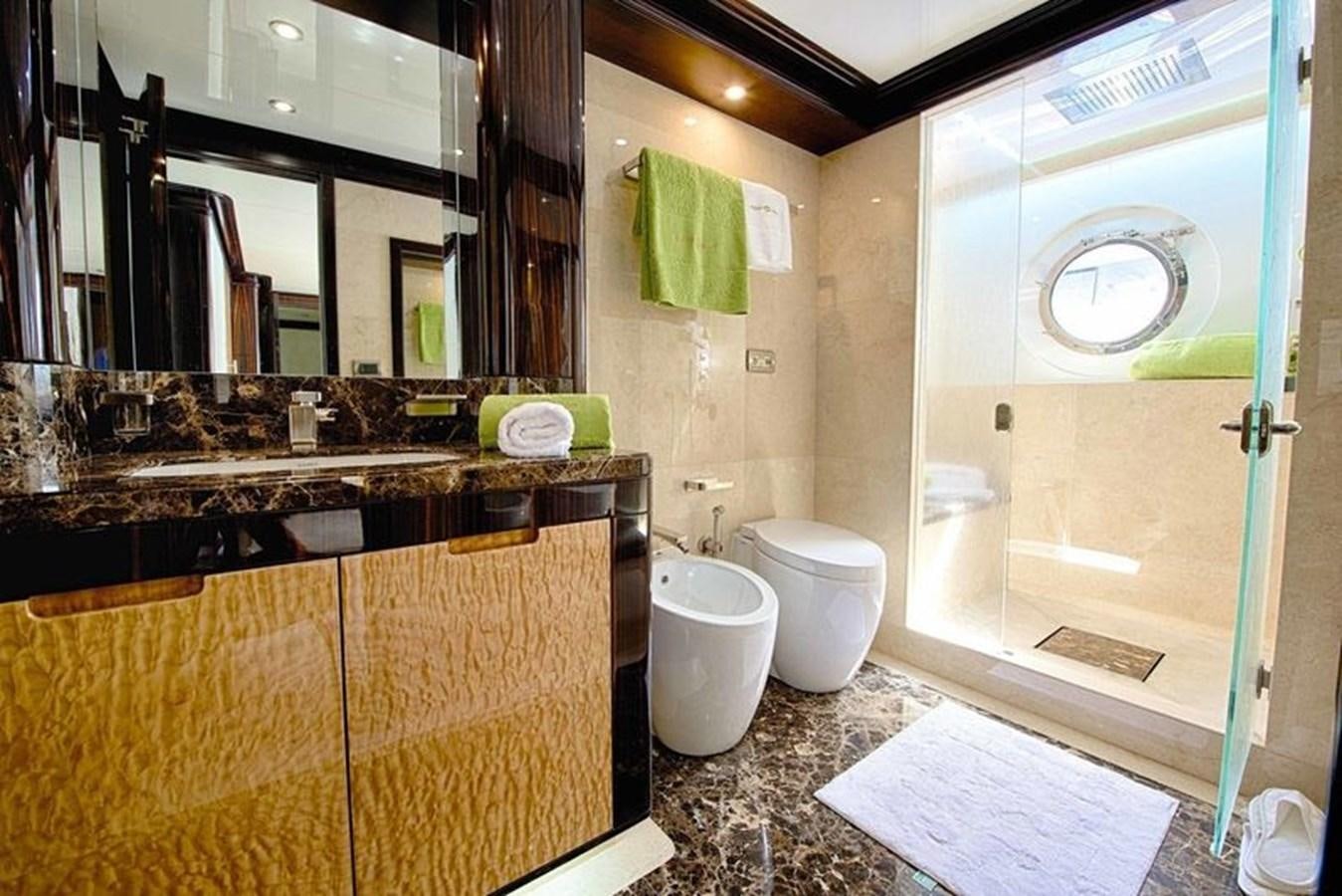 a bathroom with a glass shower aboard OCTOBER Yacht for Sale