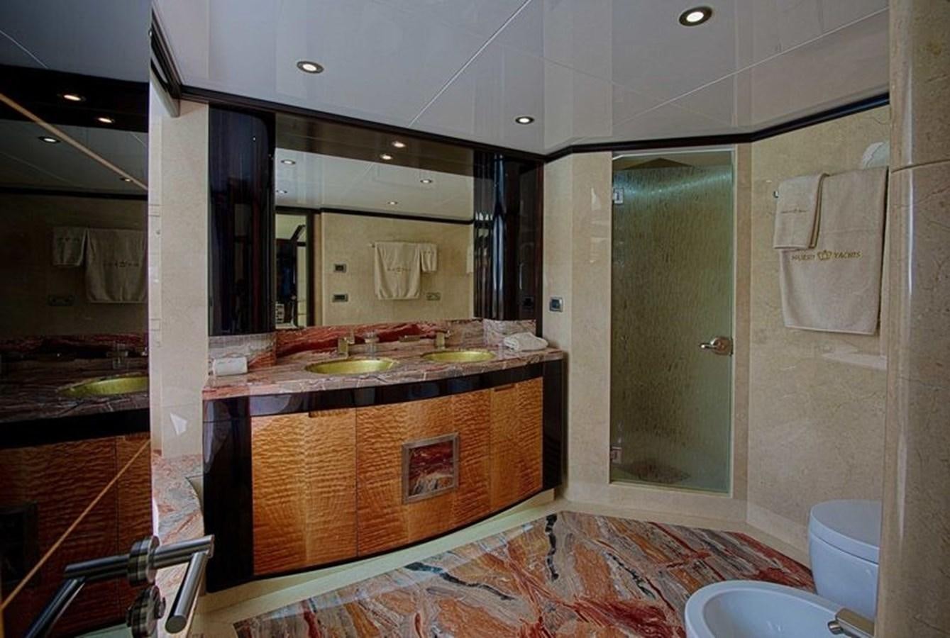 a bathroom with a large mirror aboard OCTOBER Yacht for Sale