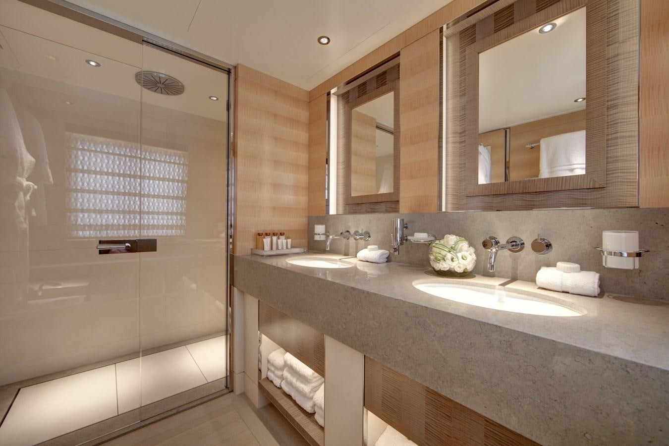a bathroom with a large mirror aboard LADY VICTORIA Yacht for Sale