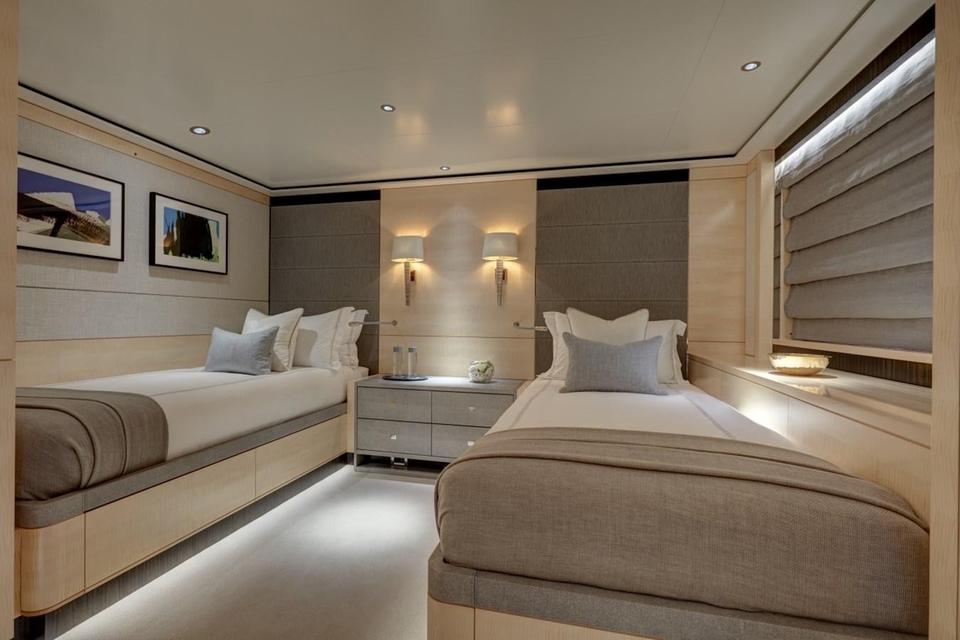 a room with a bed and a window aboard LADY VICTORIA Yacht for Sale