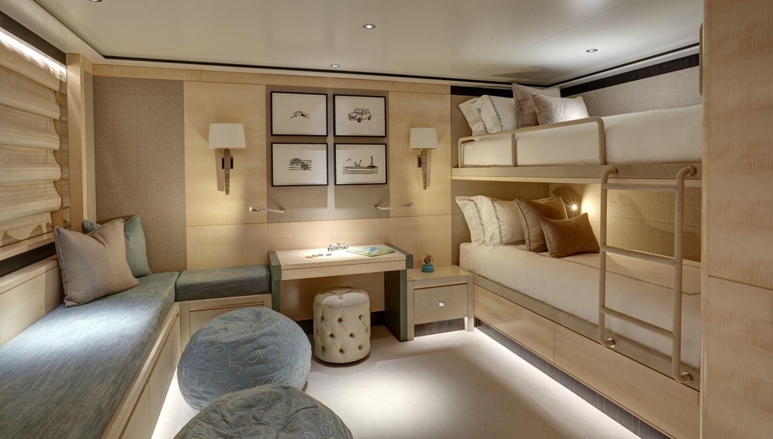 a bedroom with a bed and a desk aboard LADY VICTORIA Yacht for Sale