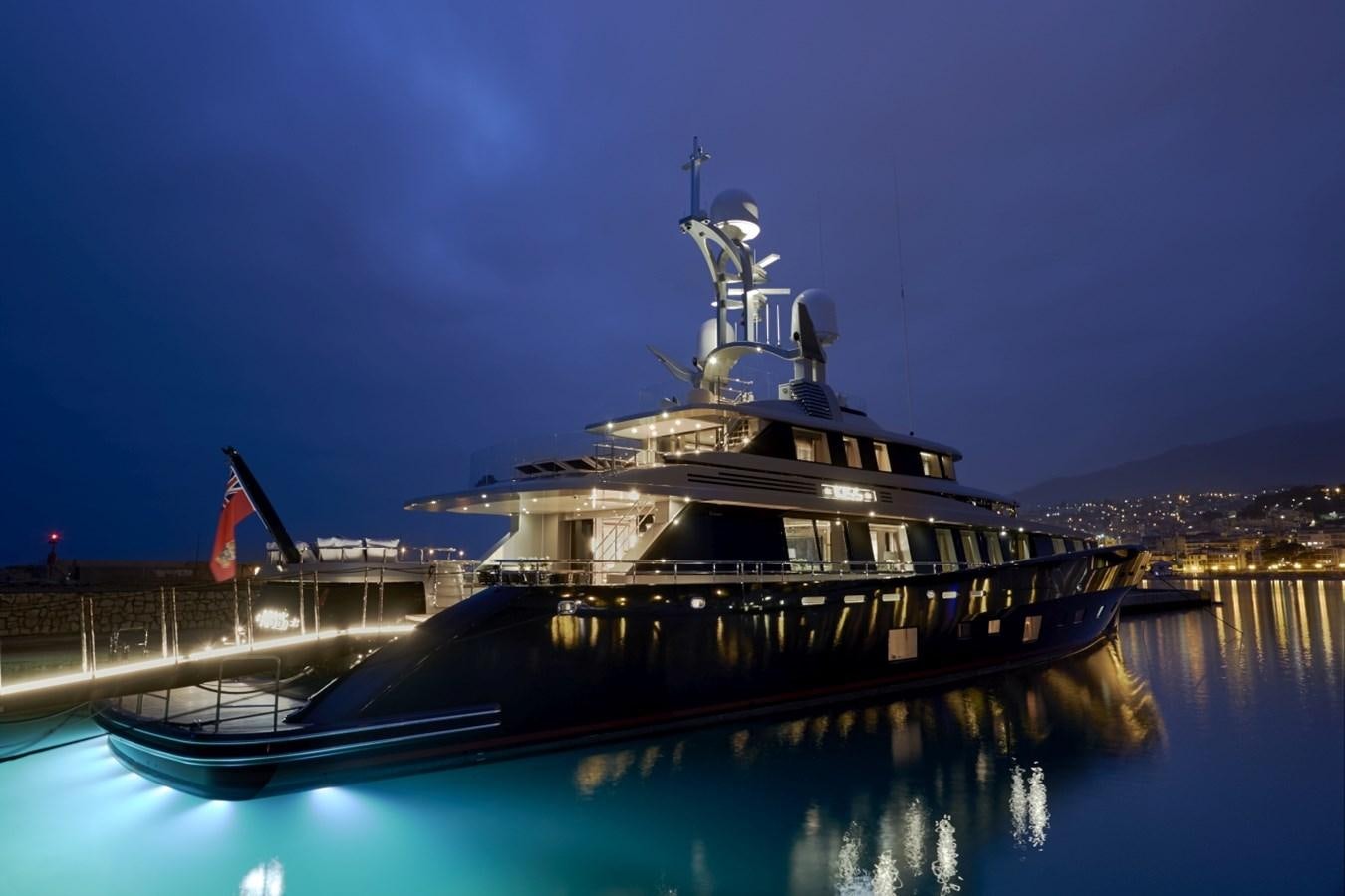 a large ship docked at night aboard LADY VICTORIA Yacht for Sale