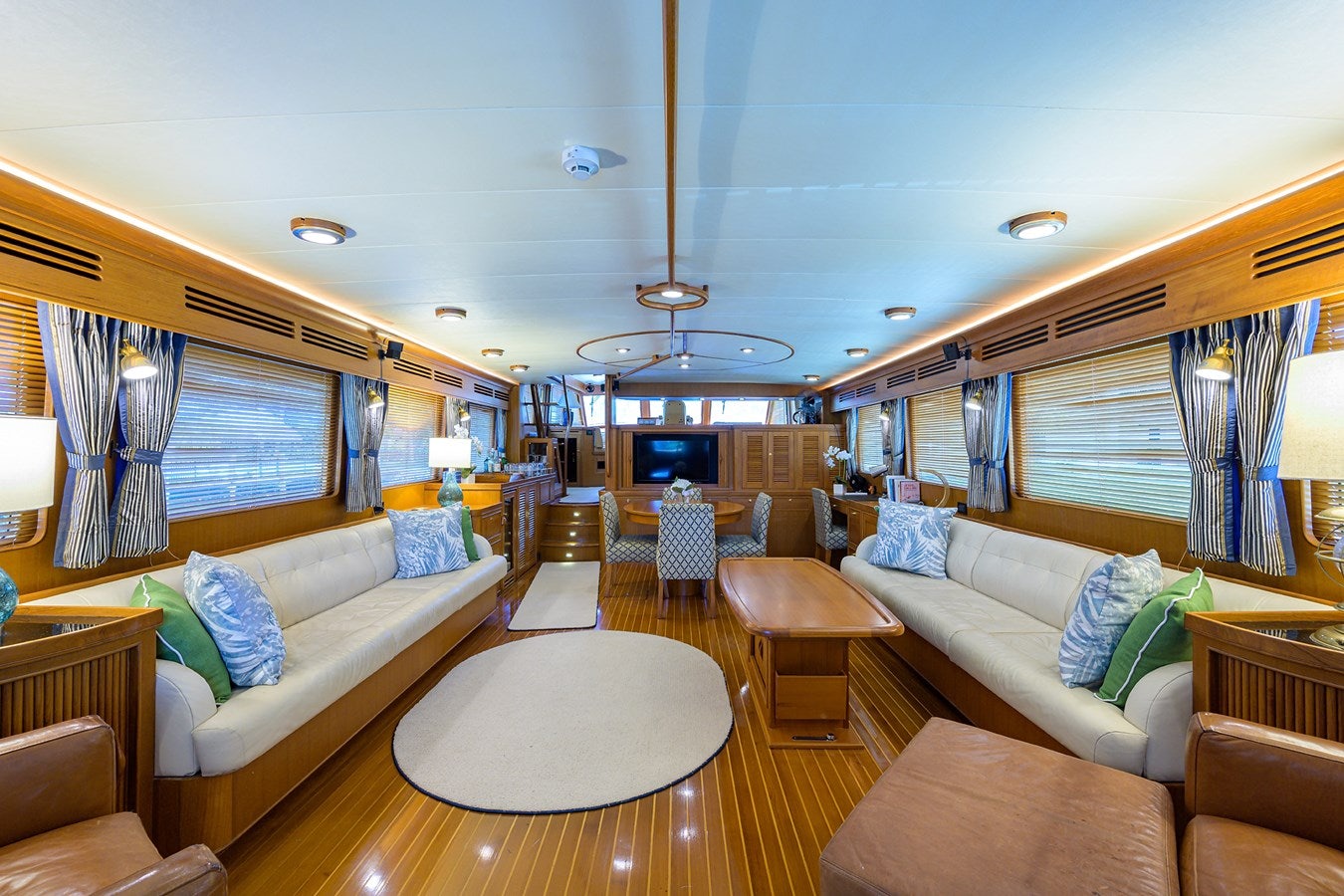 a living room with a large window aboard BELLA Yacht for Sale