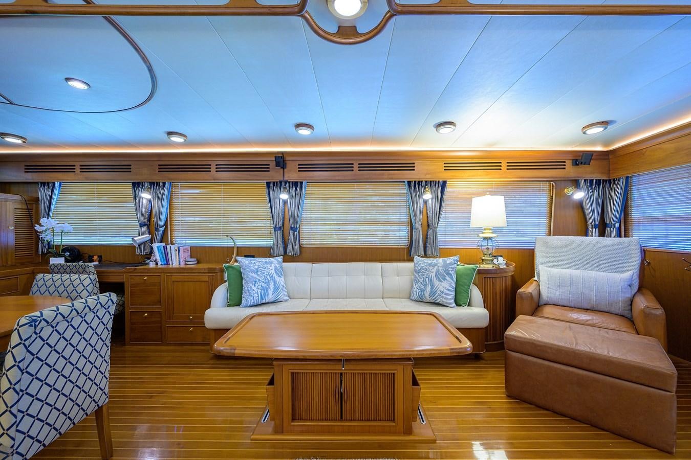 a living room with a couch and a table aboard BELLA Yacht for Sale