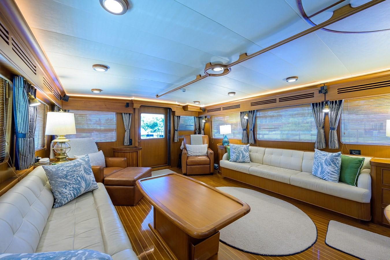 a living room with a large window aboard BELLA Yacht for Sale