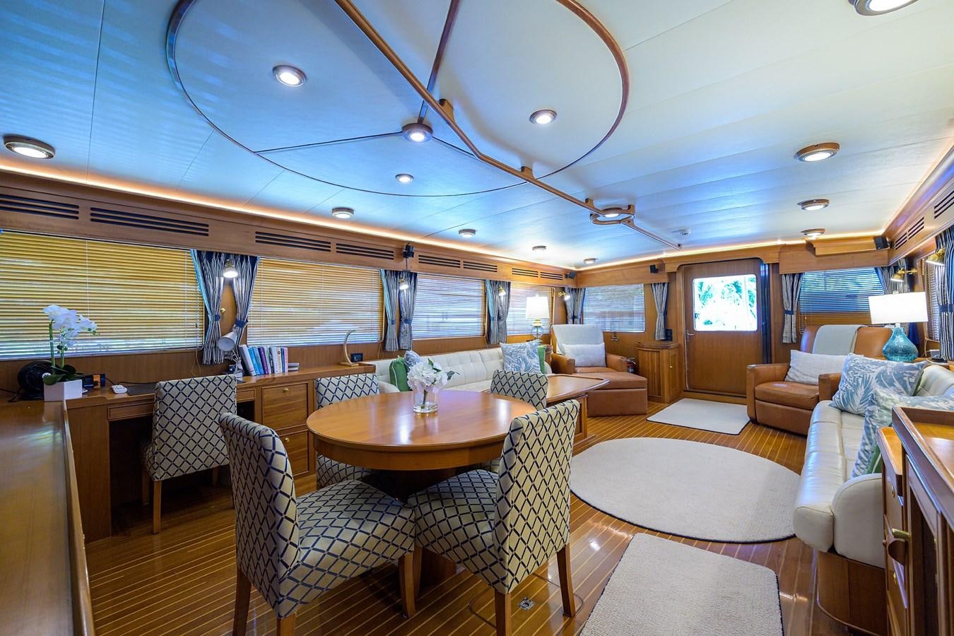 a large room with chairs and tables aboard BELLA Yacht for Sale