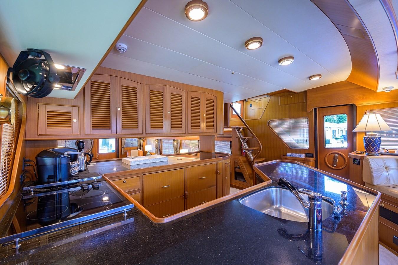 a kitchen with a large island aboard BELLA Yacht for Sale