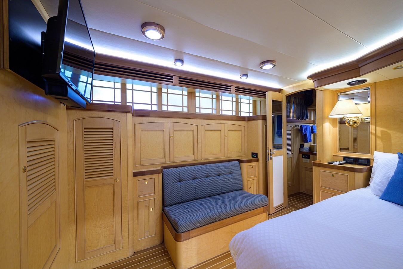 a room with a bed and a couch aboard BELLA Yacht for Sale