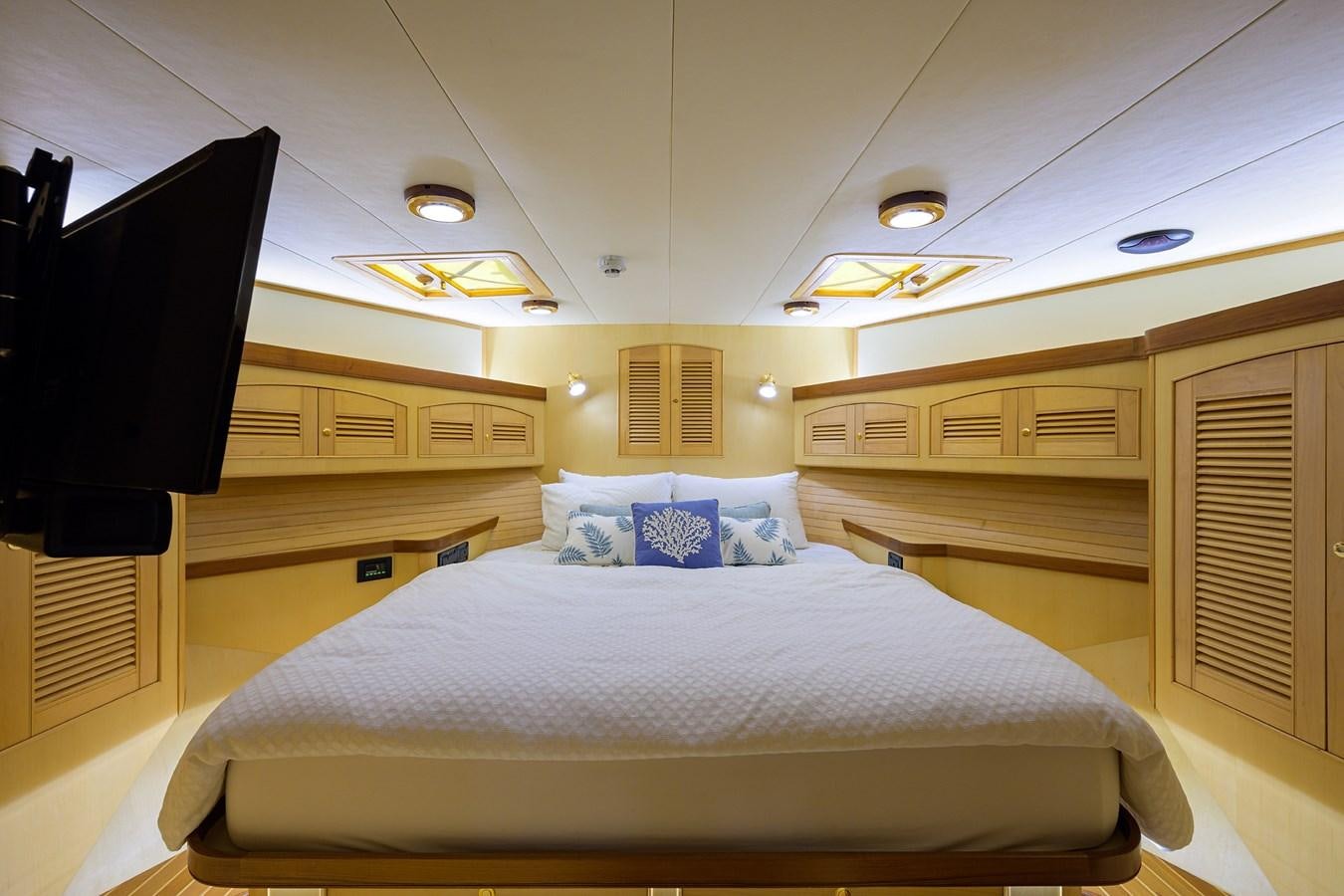 a bed in a cabin aboard BELLA Yacht for Sale