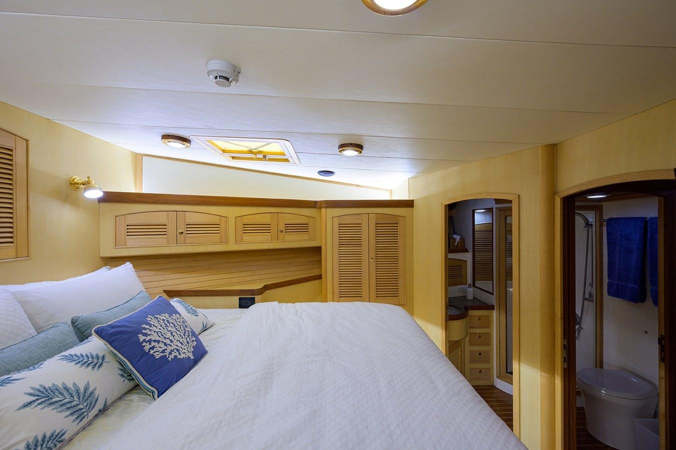 a bed in a room aboard BELLA Yacht for Sale