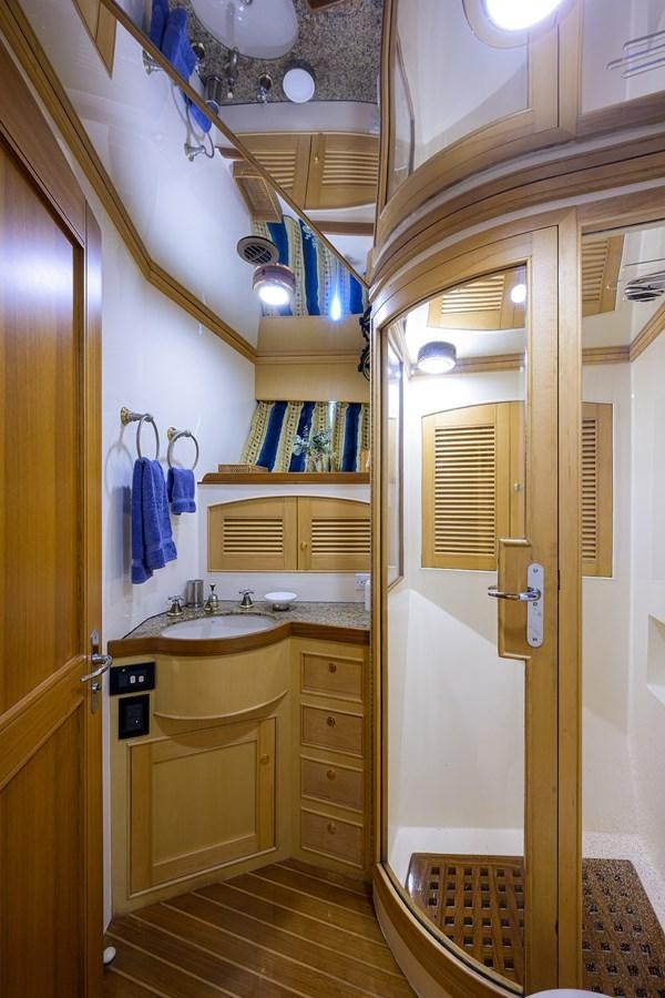 a bathroom with a sink and a mirror aboard BELLA Yacht for Sale