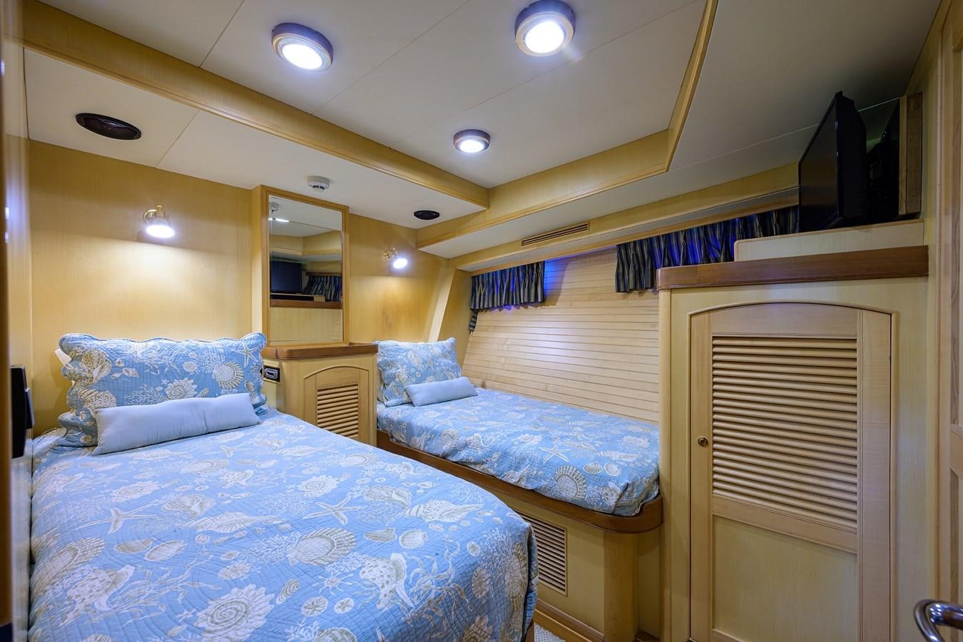 a couple of beds in a hotel room aboard BELLA Yacht for Sale