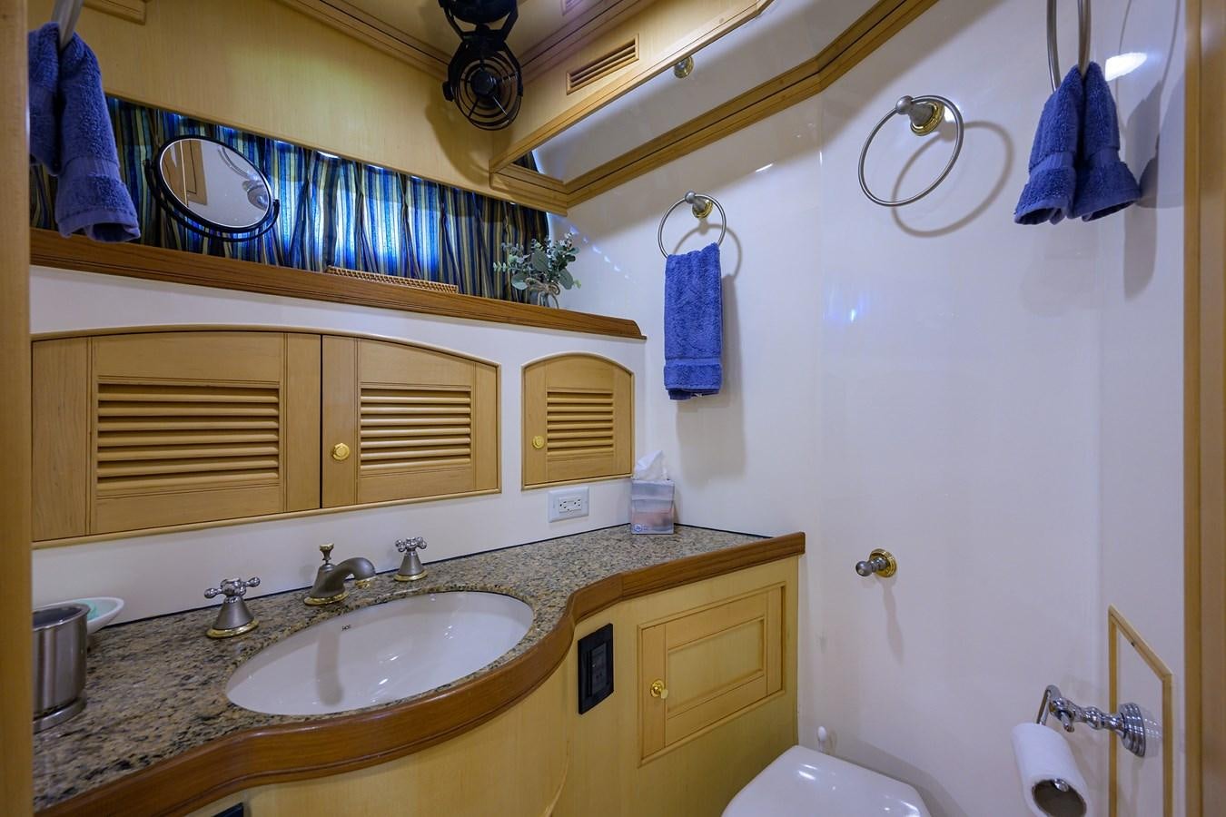 a bathroom with a sink and a mirror aboard BELLA Yacht for Sale