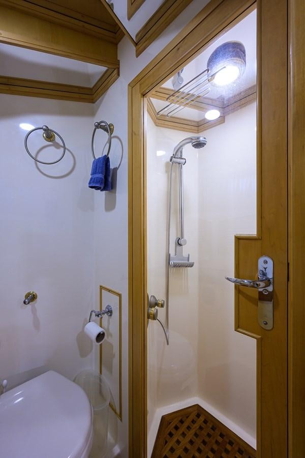 a bathroom with a shower and toilet aboard BELLA Yacht for Sale