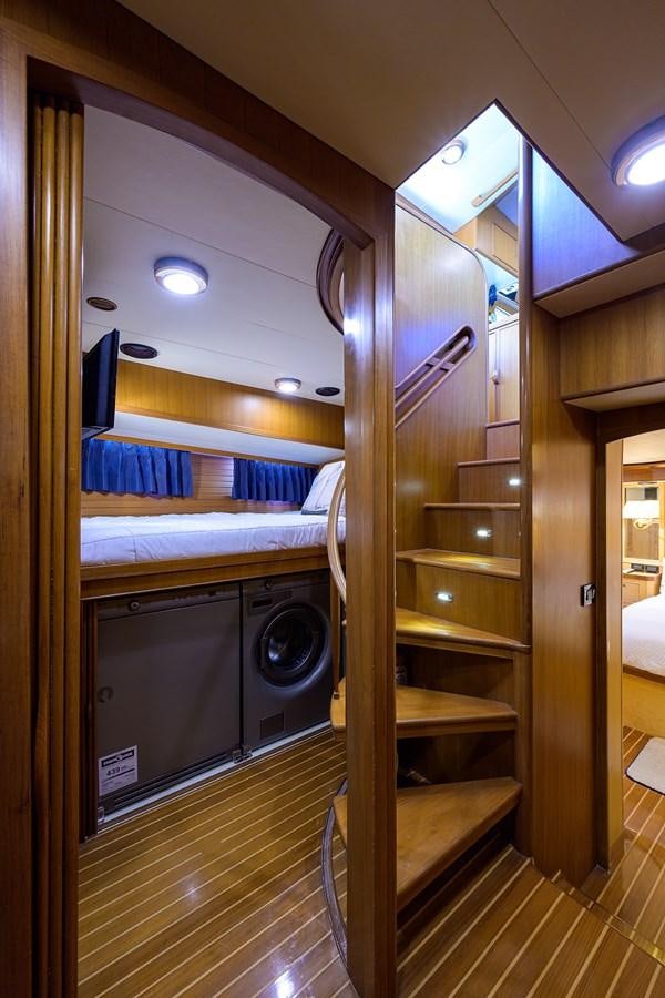 a closet with a bed and a ladder aboard BELLA Yacht for Sale