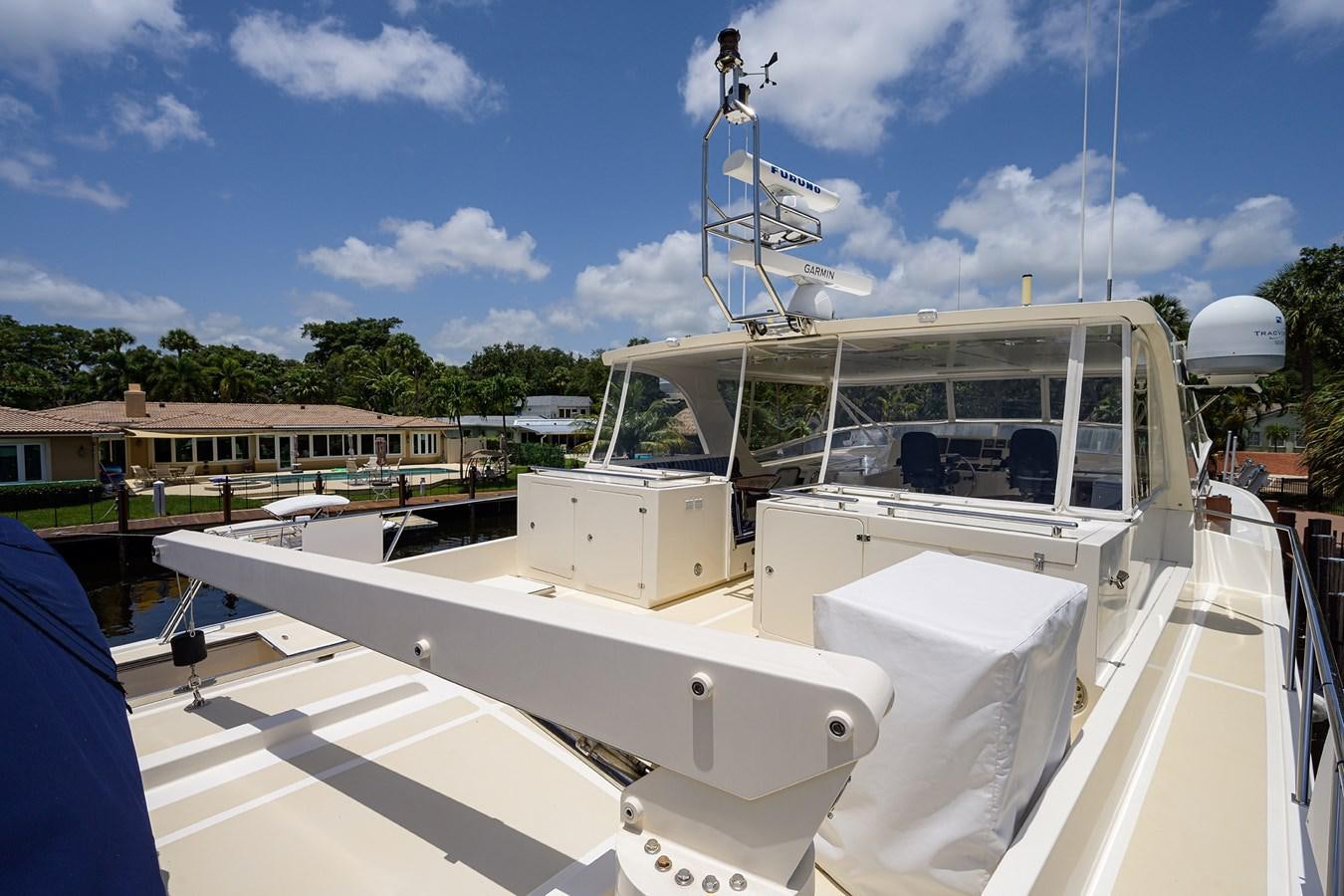 a white boat with a white sail aboard BELLA Yacht for Sale