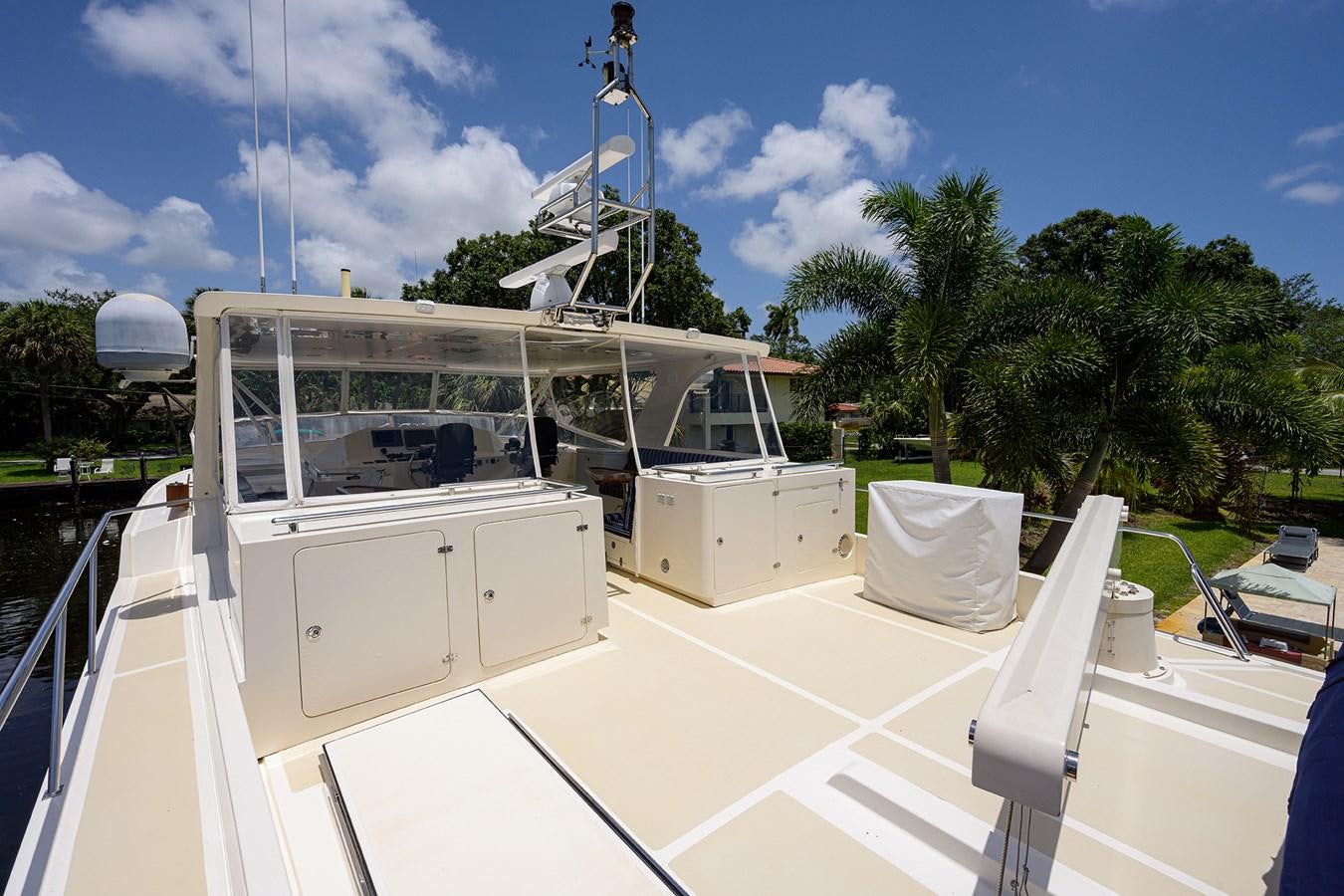 a white boat on a deck aboard BELLA Yacht for Sale