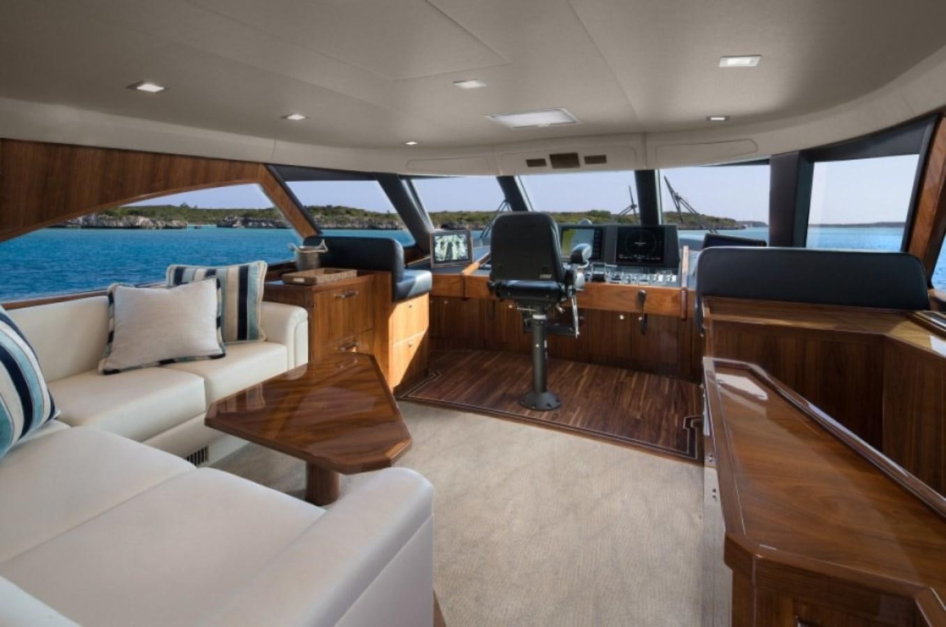 inside of a car aboard NEW VIKING 80 ENCLOSED BRIDGE Yacht for Sale