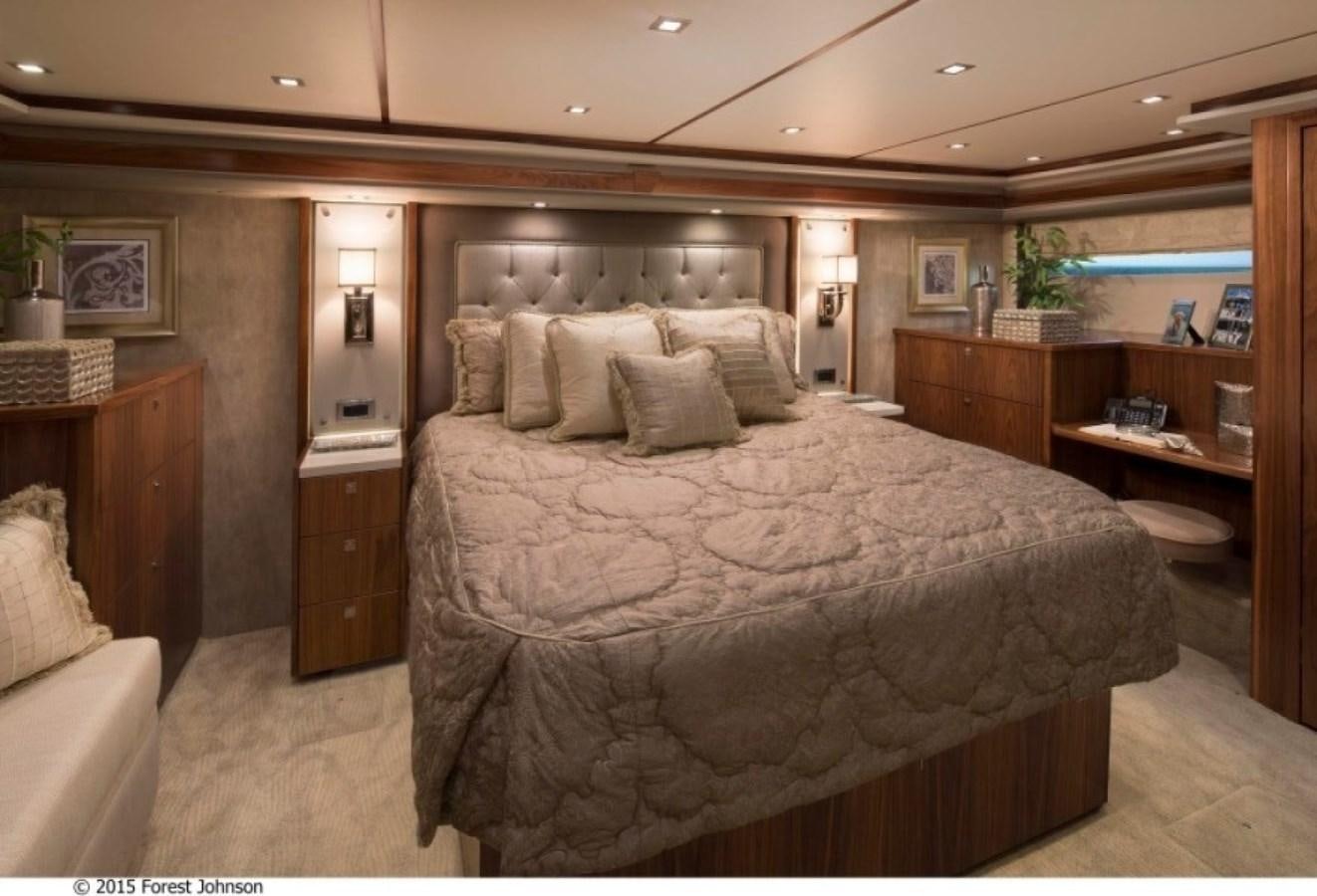 a large bed in a room aboard NEW VIKING 80 ENCLOSED BRIDGE Yacht for Sale