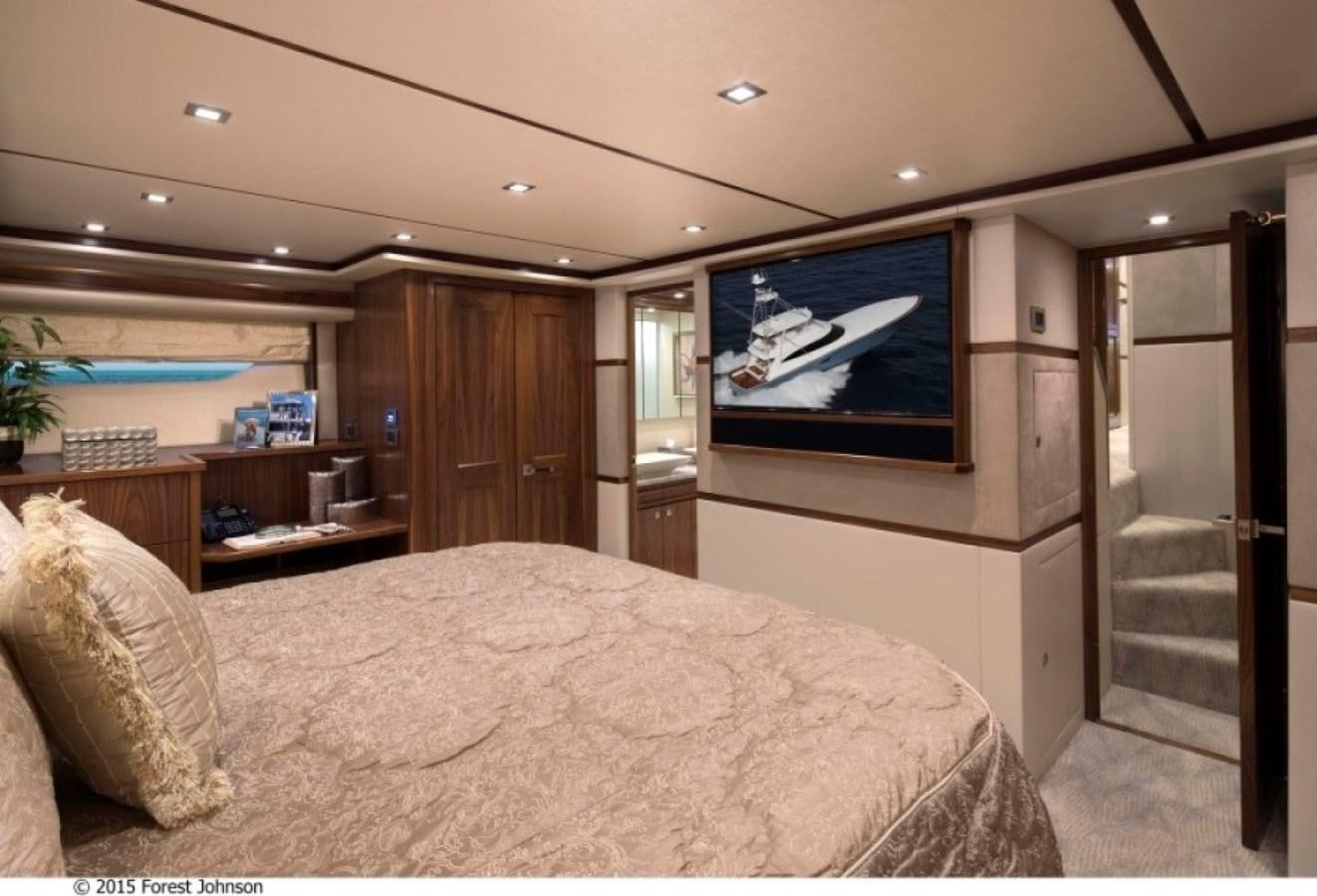 a bedroom with a large bed aboard NEW VIKING 80 ENCLOSED BRIDGE Yacht for Sale