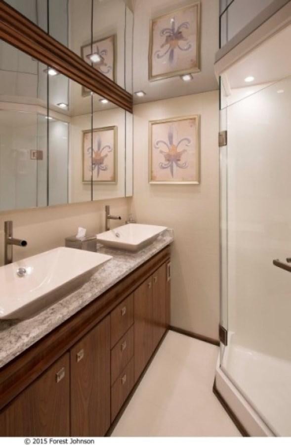 a bathroom with two sinks aboard NEW VIKING 80 ENCLOSED BRIDGE Yacht for Sale