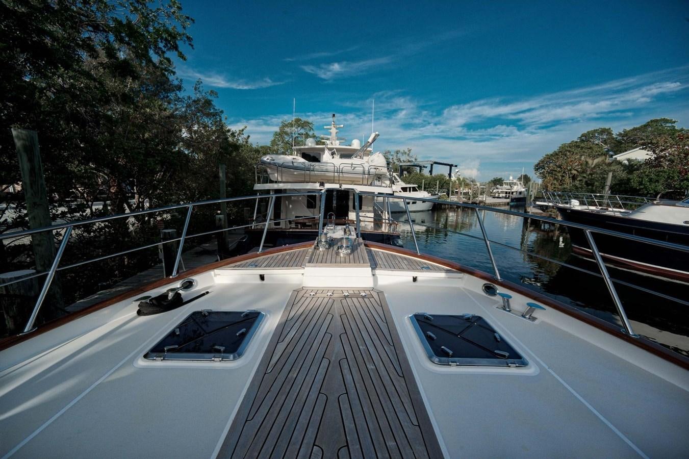 a boat docked at a pier aboard BEN'S BARGE Yacht for Sale