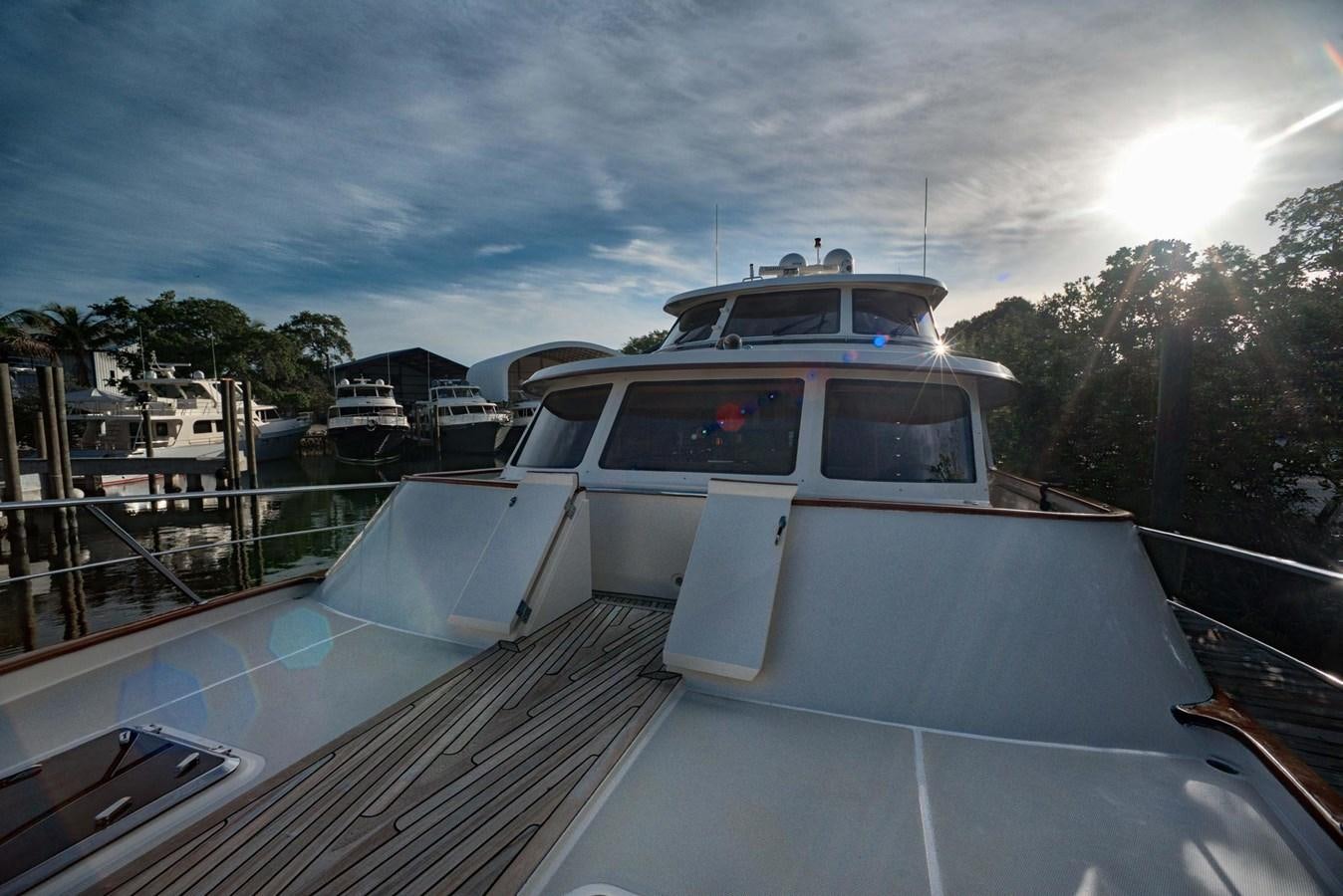 a boat docked at a pier aboard BEN'S BARGE Yacht for Sale