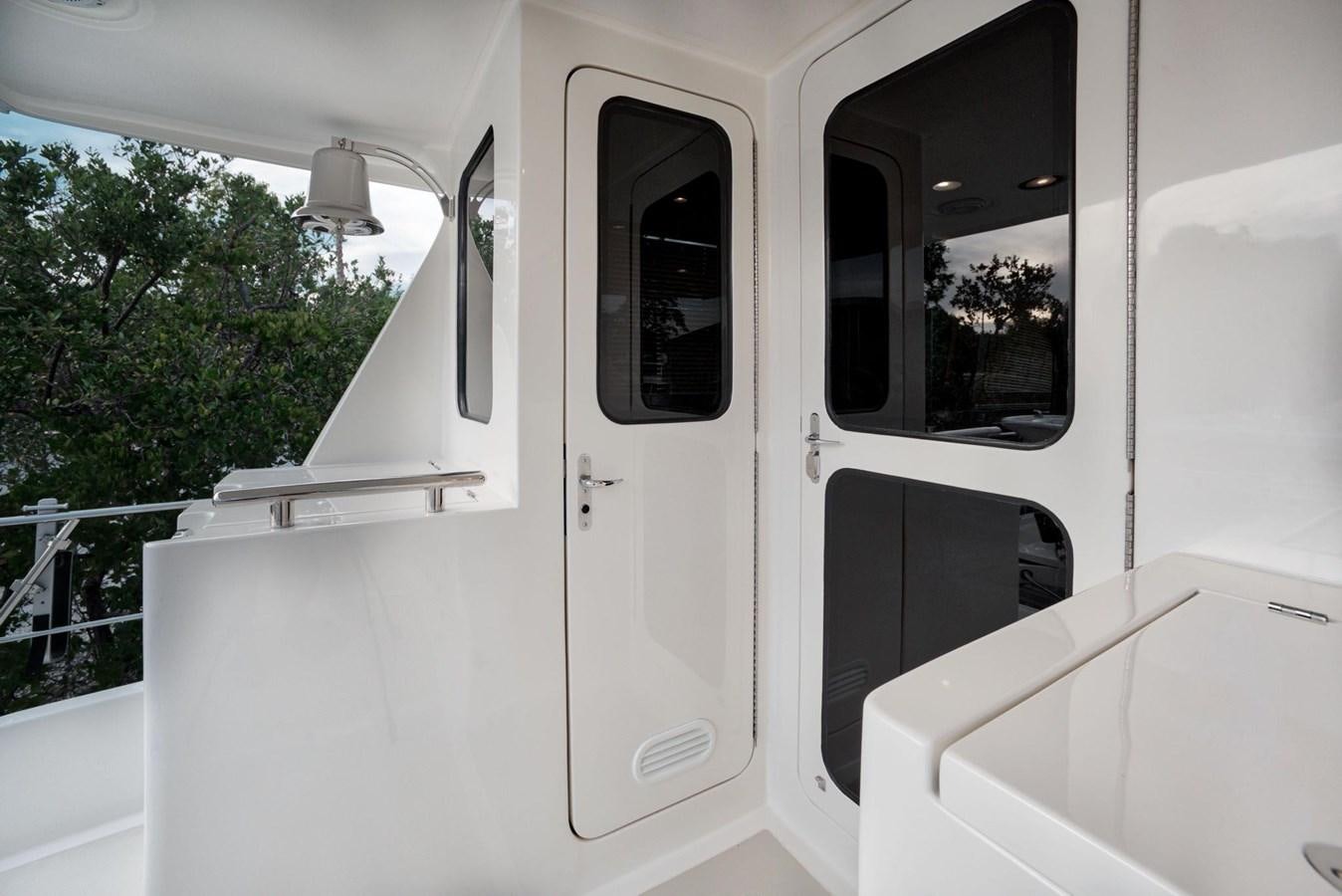 a white car with a door open aboard BEN'S BARGE Yacht for Sale