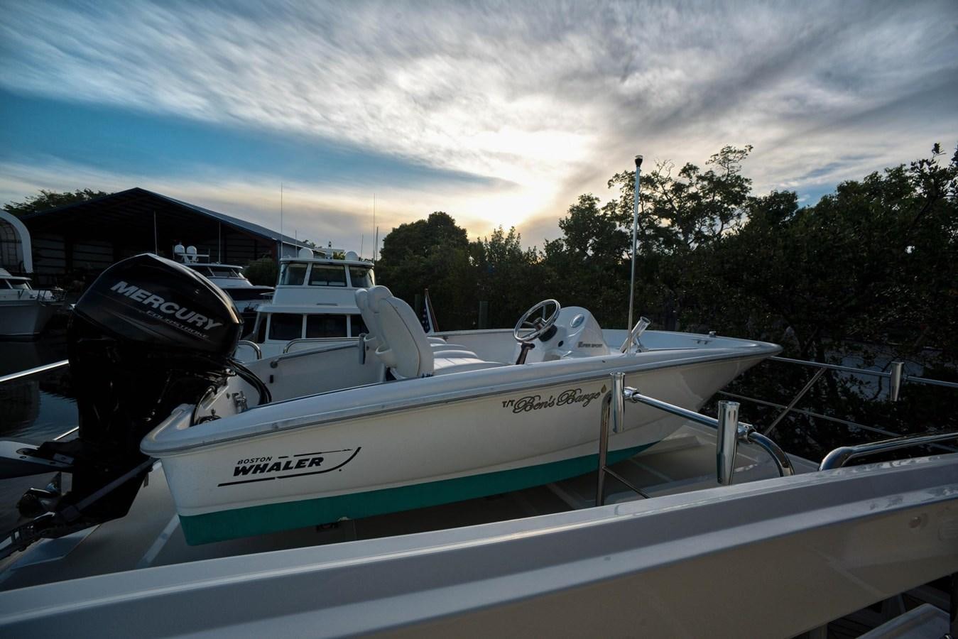 a boat parked in a harbor aboard BEN'S BARGE Yacht for Sale