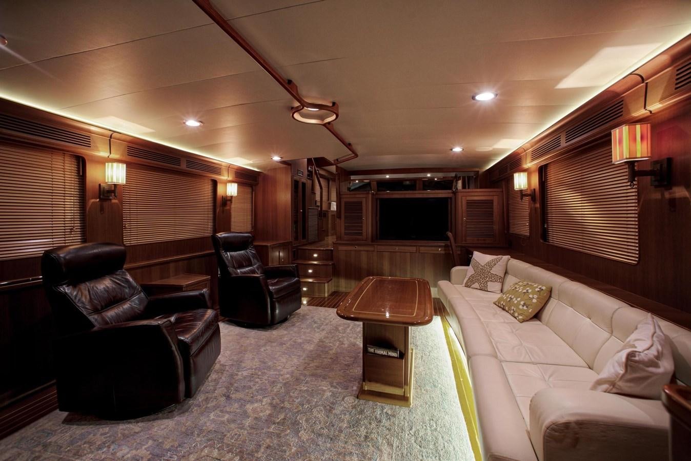 a living room with a couch and a table aboard BEN'S BARGE Yacht for Sale