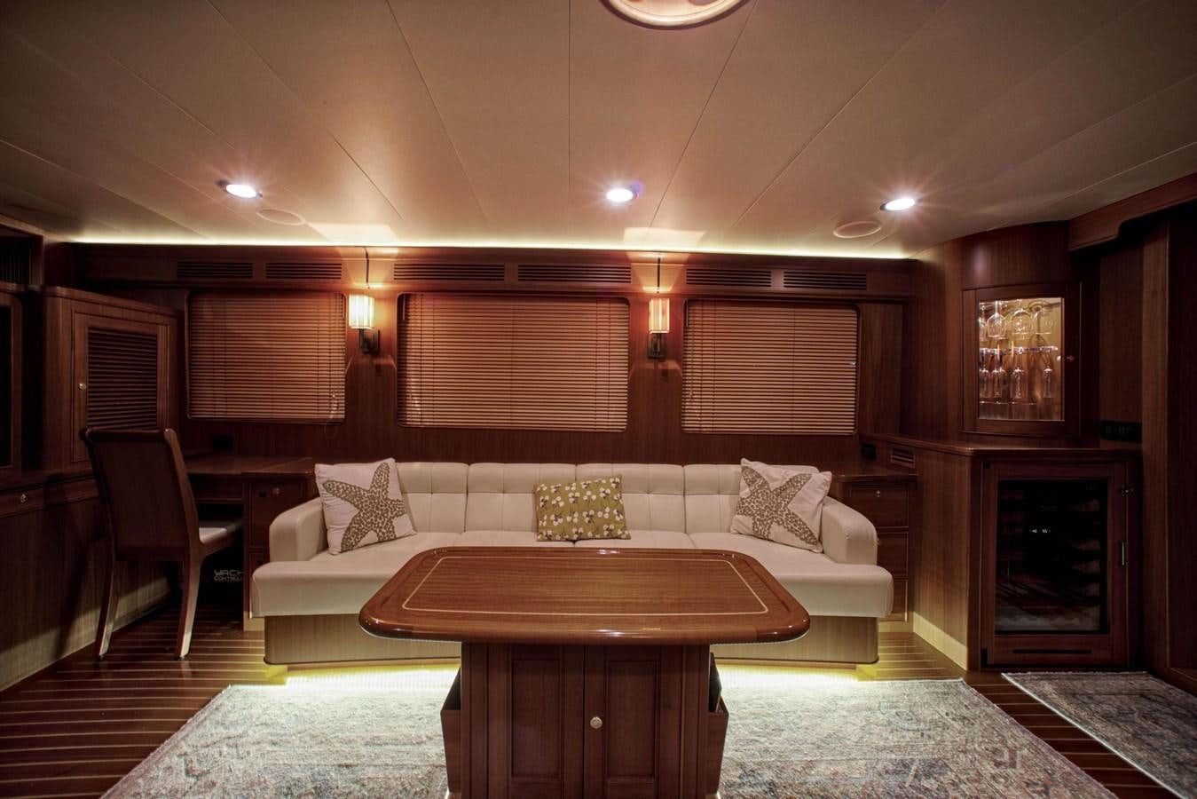 a living room with a couch and a table aboard BEN'S BARGE Yacht for Sale