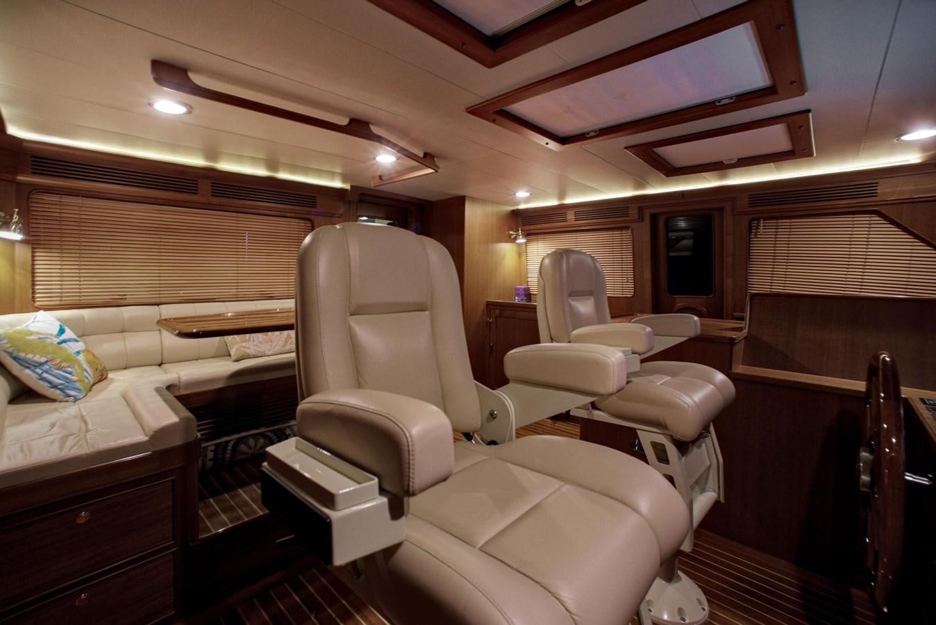 a room with a bed and a couch aboard BEN'S BARGE Yacht for Sale