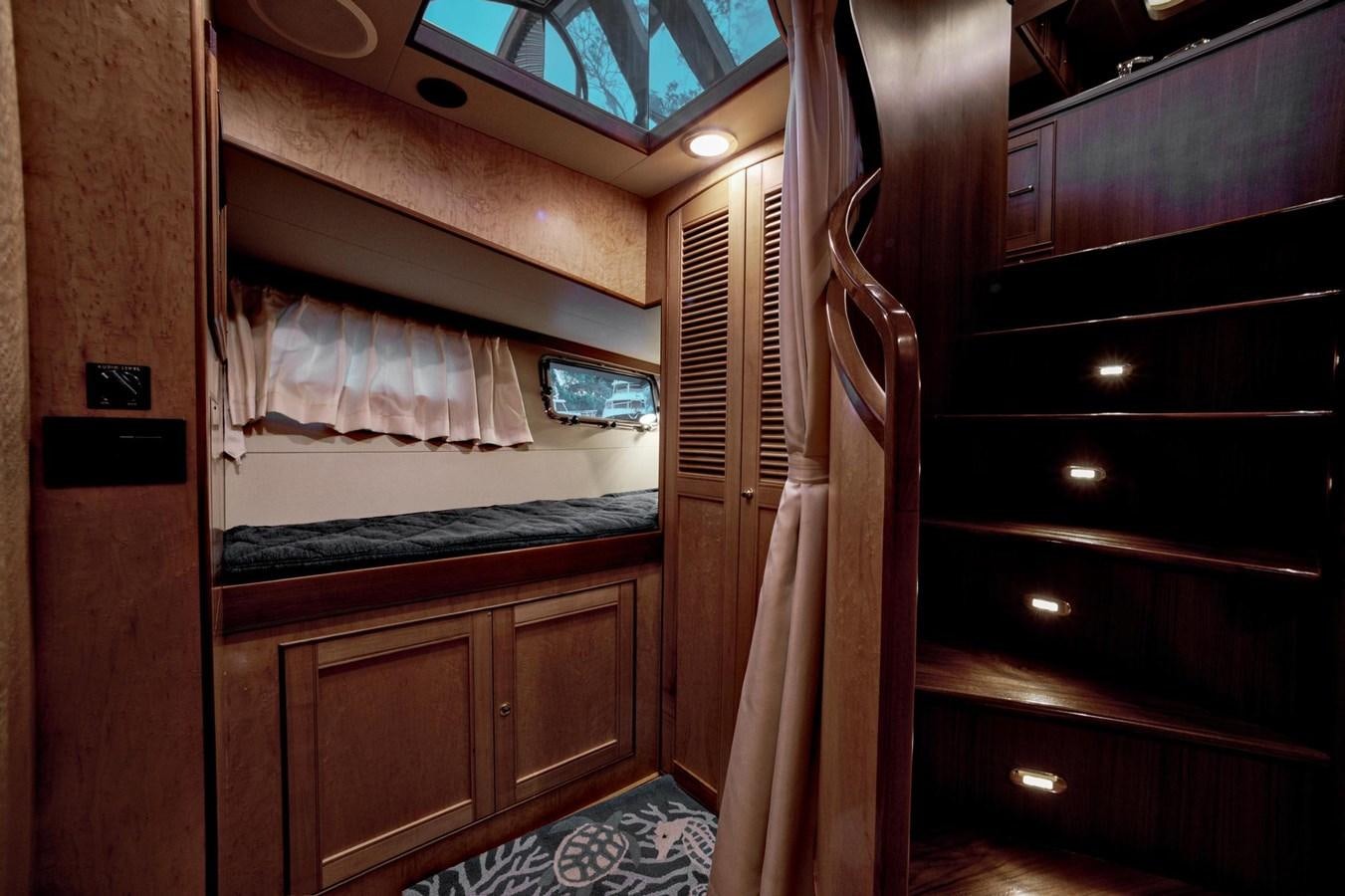 a room with wooden cabinets aboard BEN'S BARGE Yacht for Sale