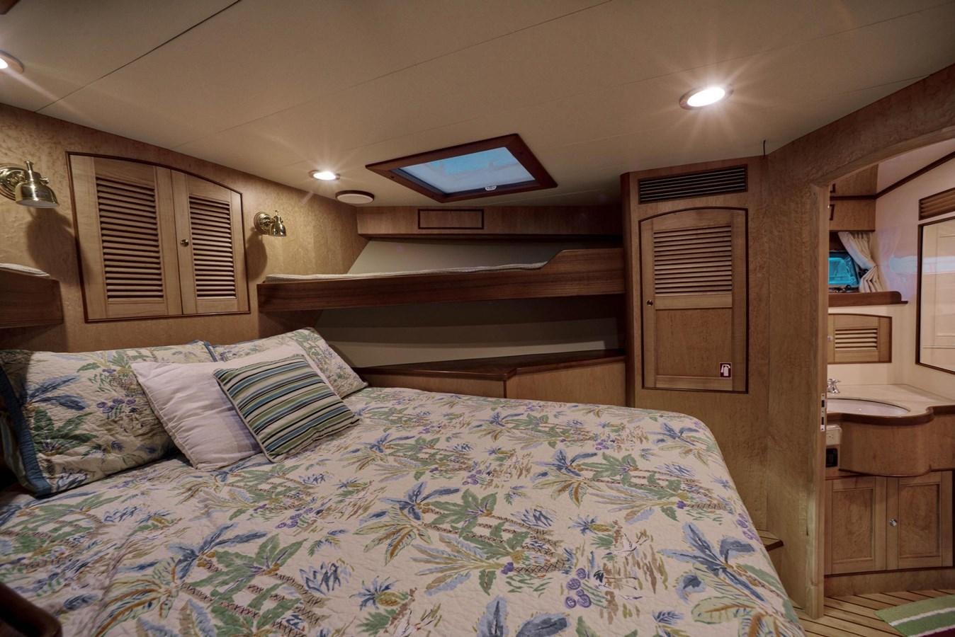 a bed in a room aboard BEN'S BARGE Yacht for Sale