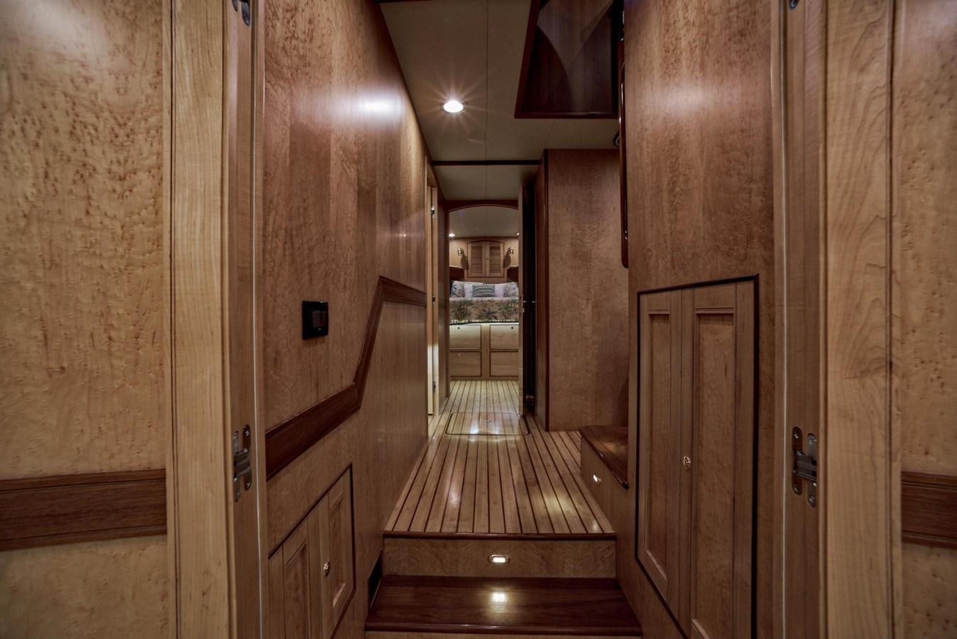 a hallway with wooden doors aboard BEN'S BARGE Yacht for Sale