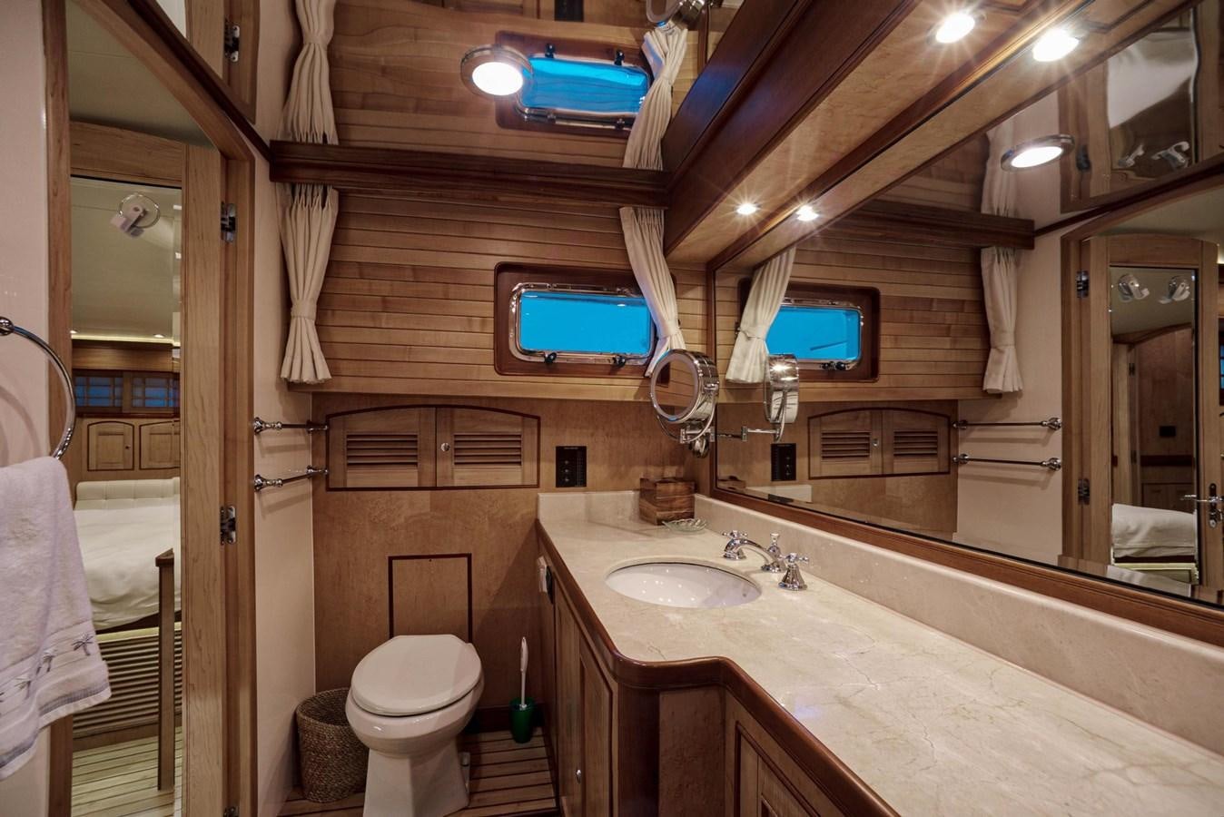 a bathroom with a toilet and sink aboard BEN'S BARGE Yacht for Sale