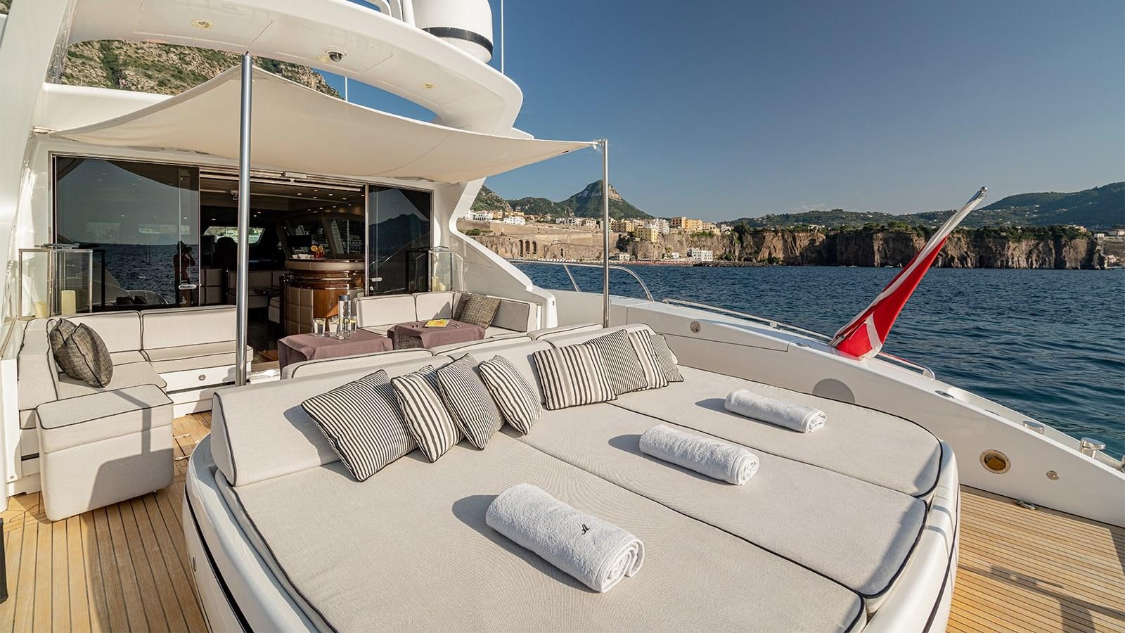 a white bed on a boat aboard DEVA I Yacht for Sale