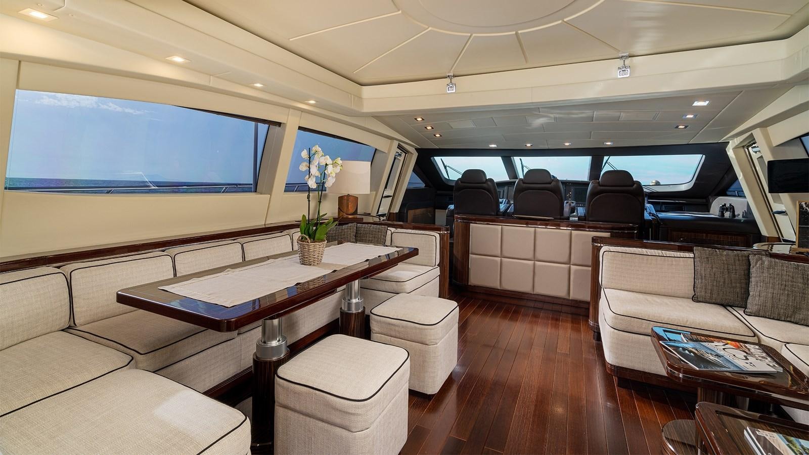 a room with a couch and a table aboard DEVA I Yacht for Sale