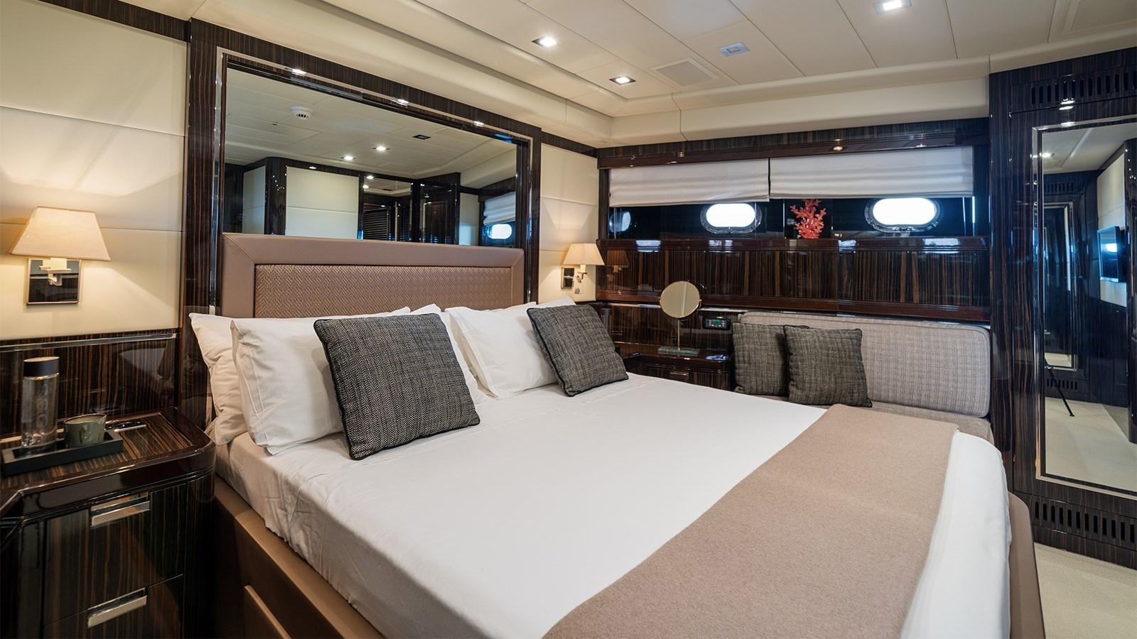 a hotel room with a large bed aboard DEVA I Yacht for Sale