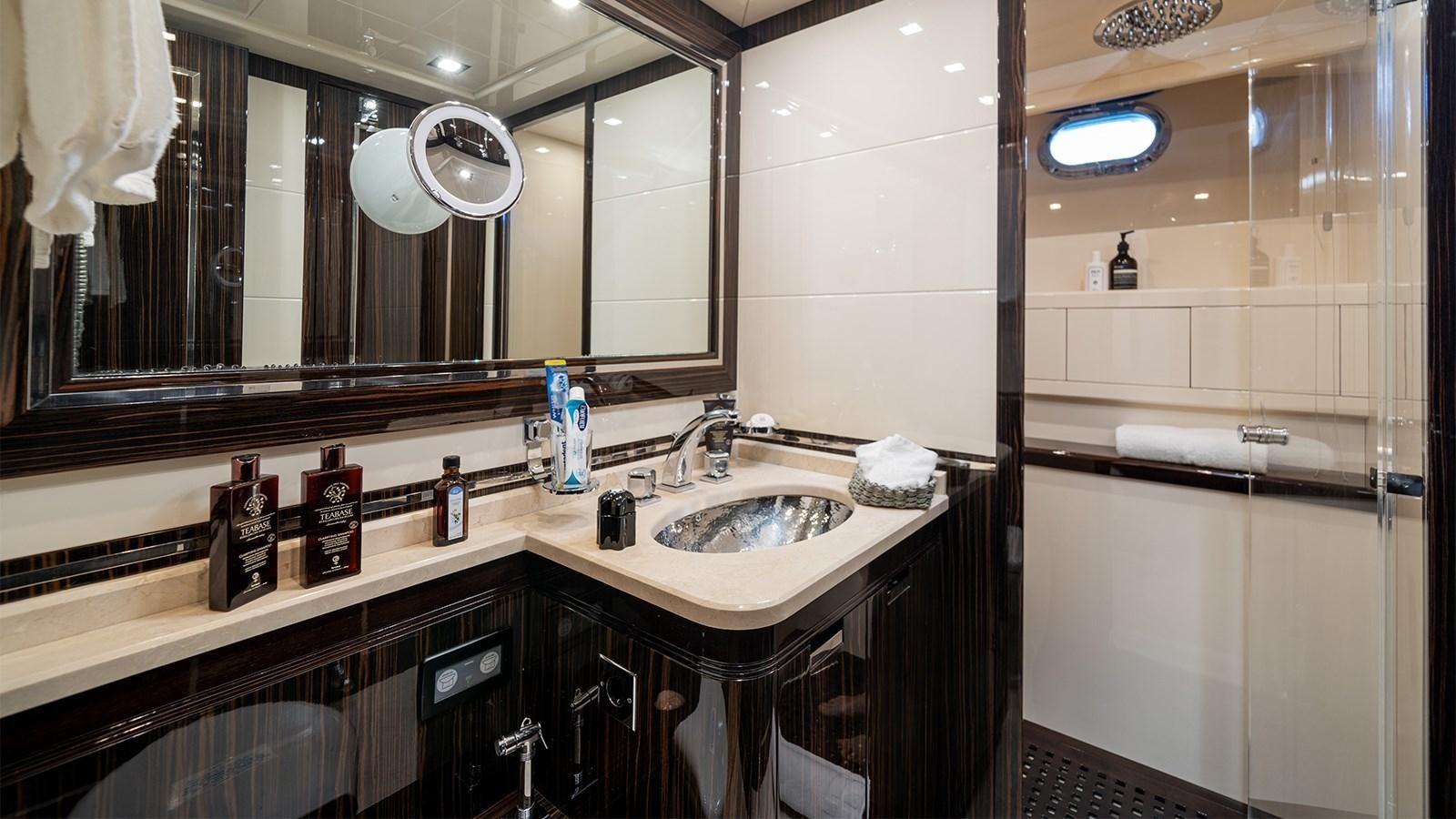 a bathroom with a sink and a mirror aboard DEVA I Yacht for Sale